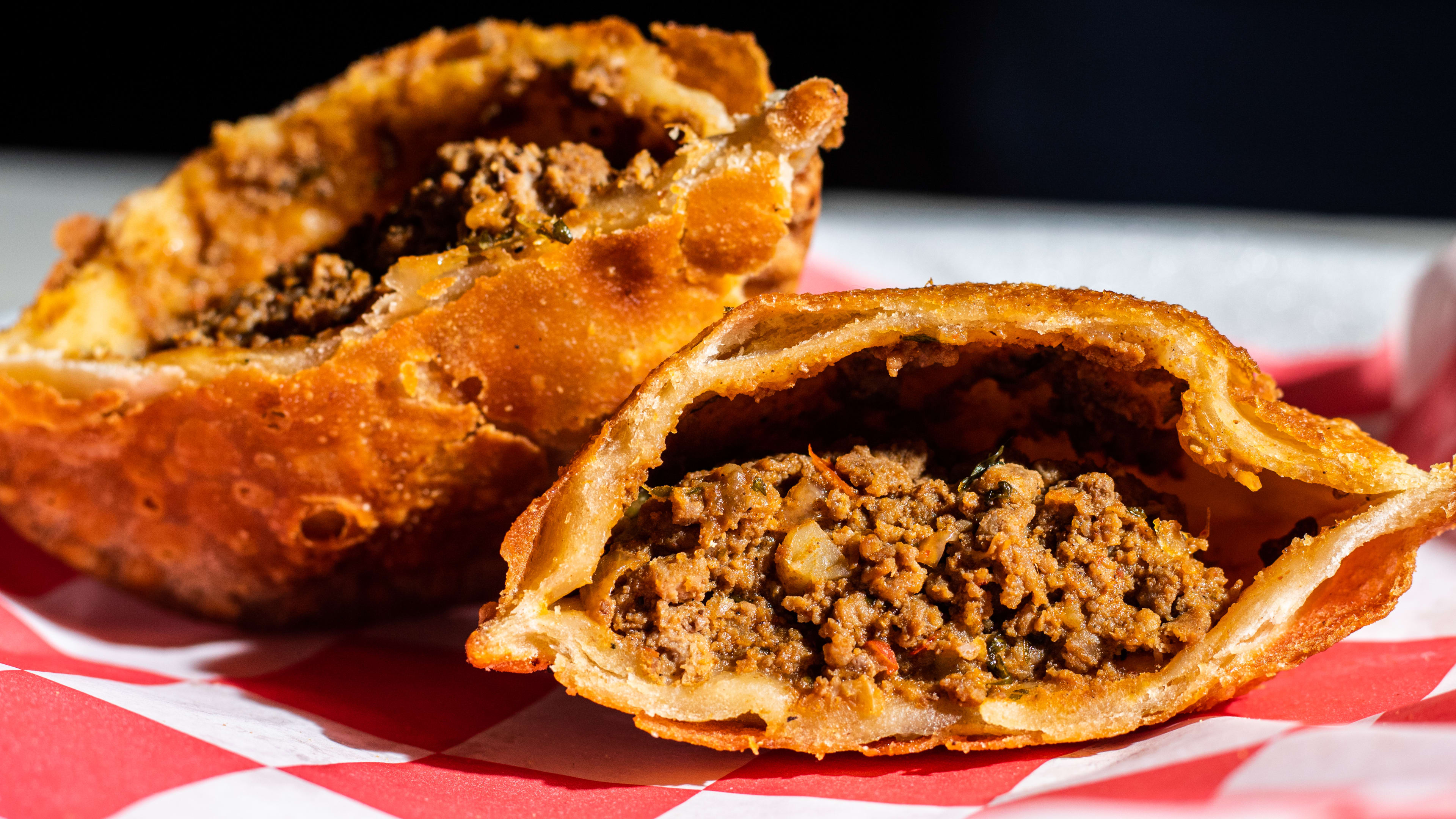 The cross-section of a fried empanada.