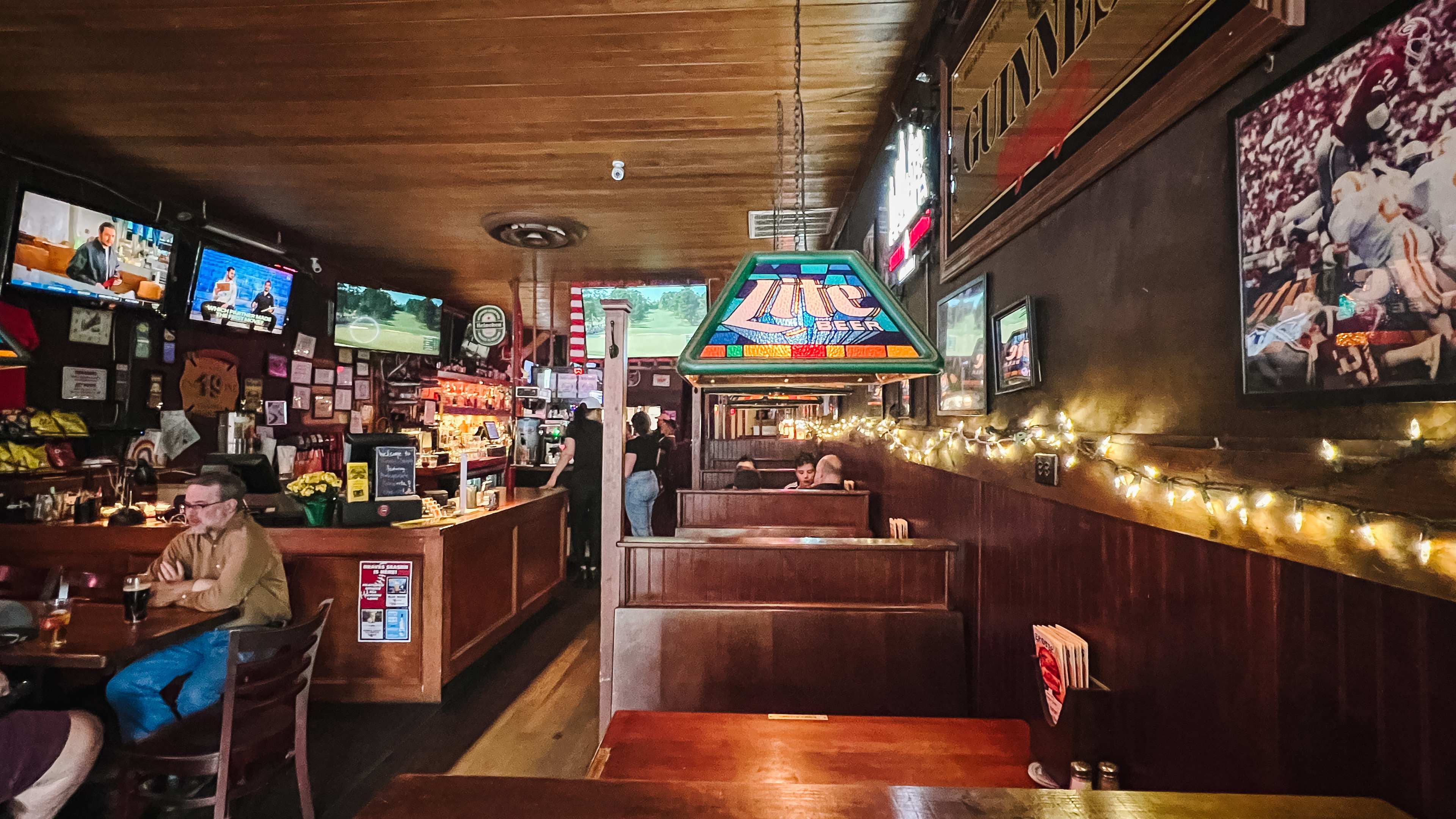 Wooden booths and the bar of George's.