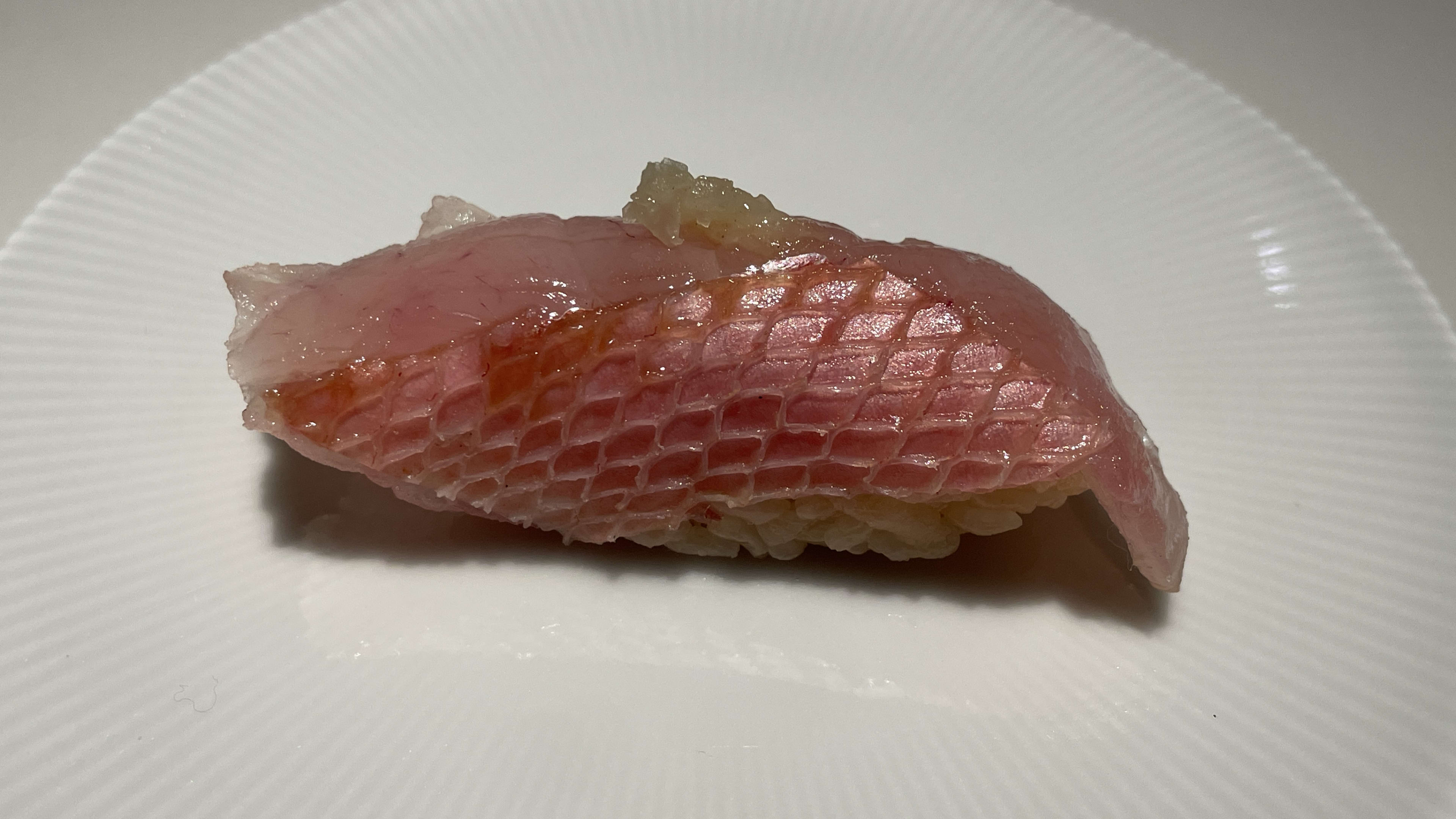 raw fish nigiri over rice