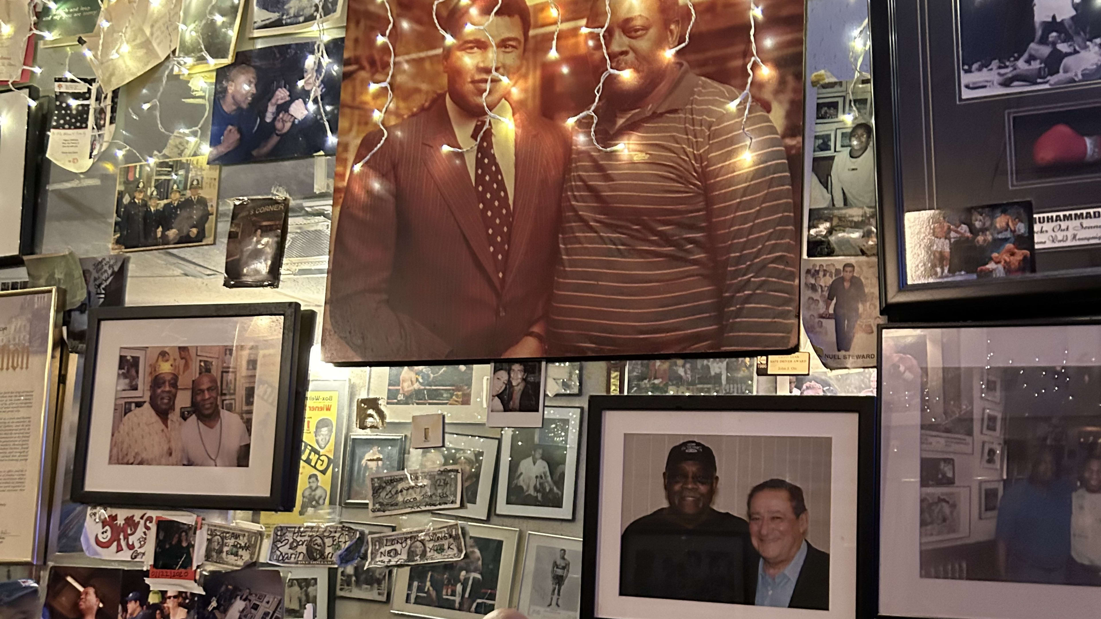 Photos covering the wall at Jimmy's Corner.