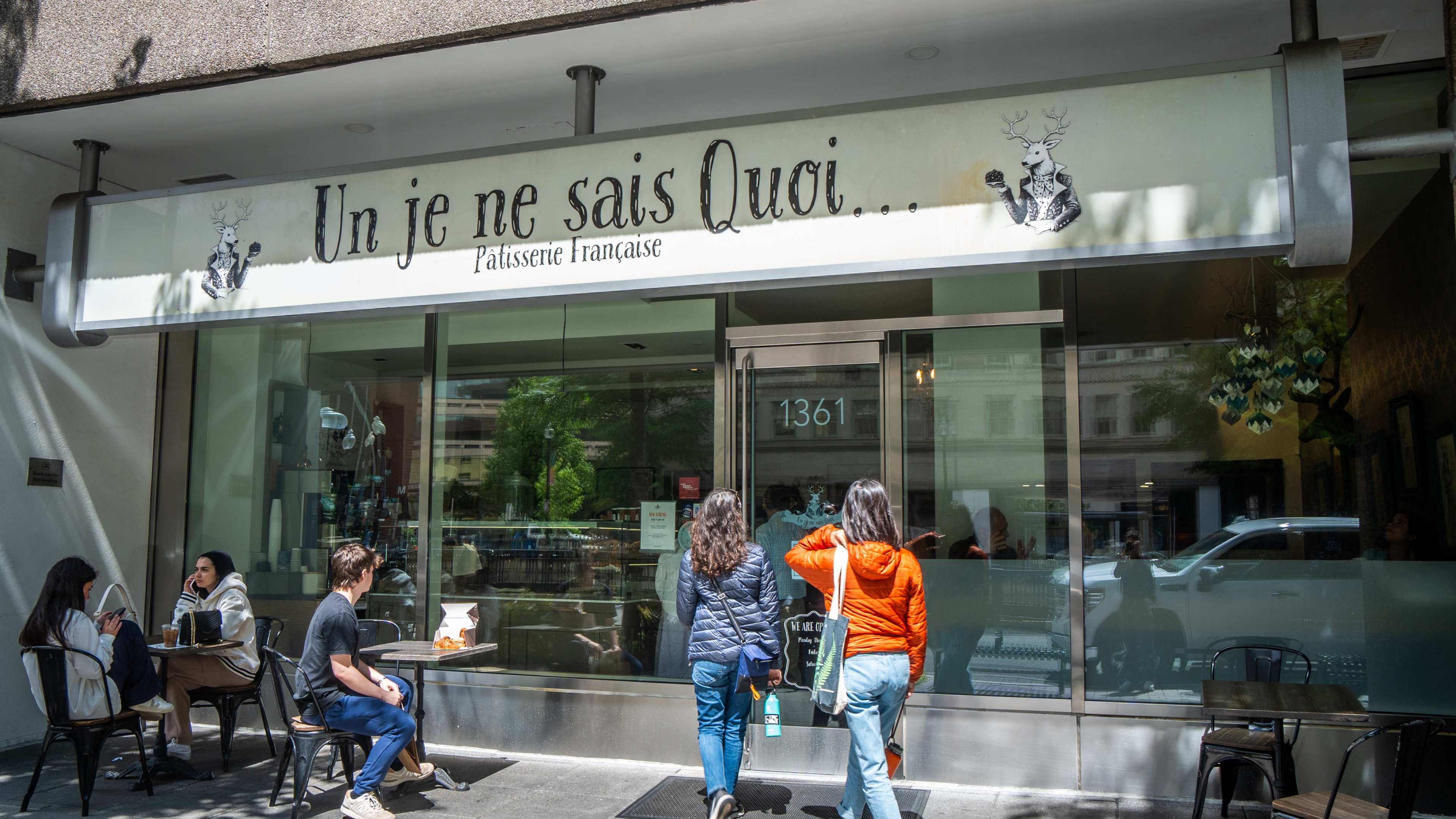 exterior of bakery with people dining outside in the sun