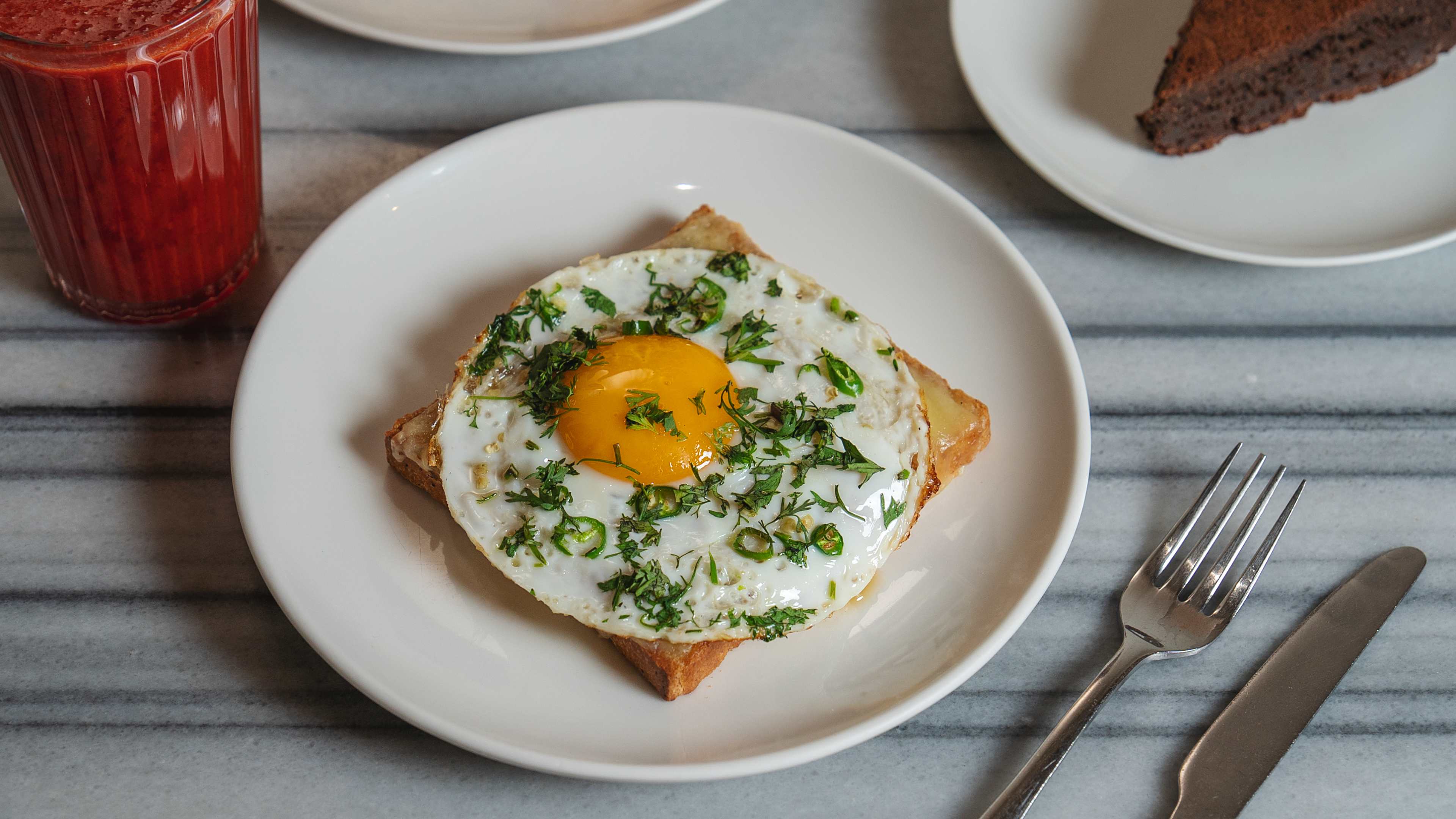 Eggs kejriwal on white ceramic plate at Kala Ghoda Cafe