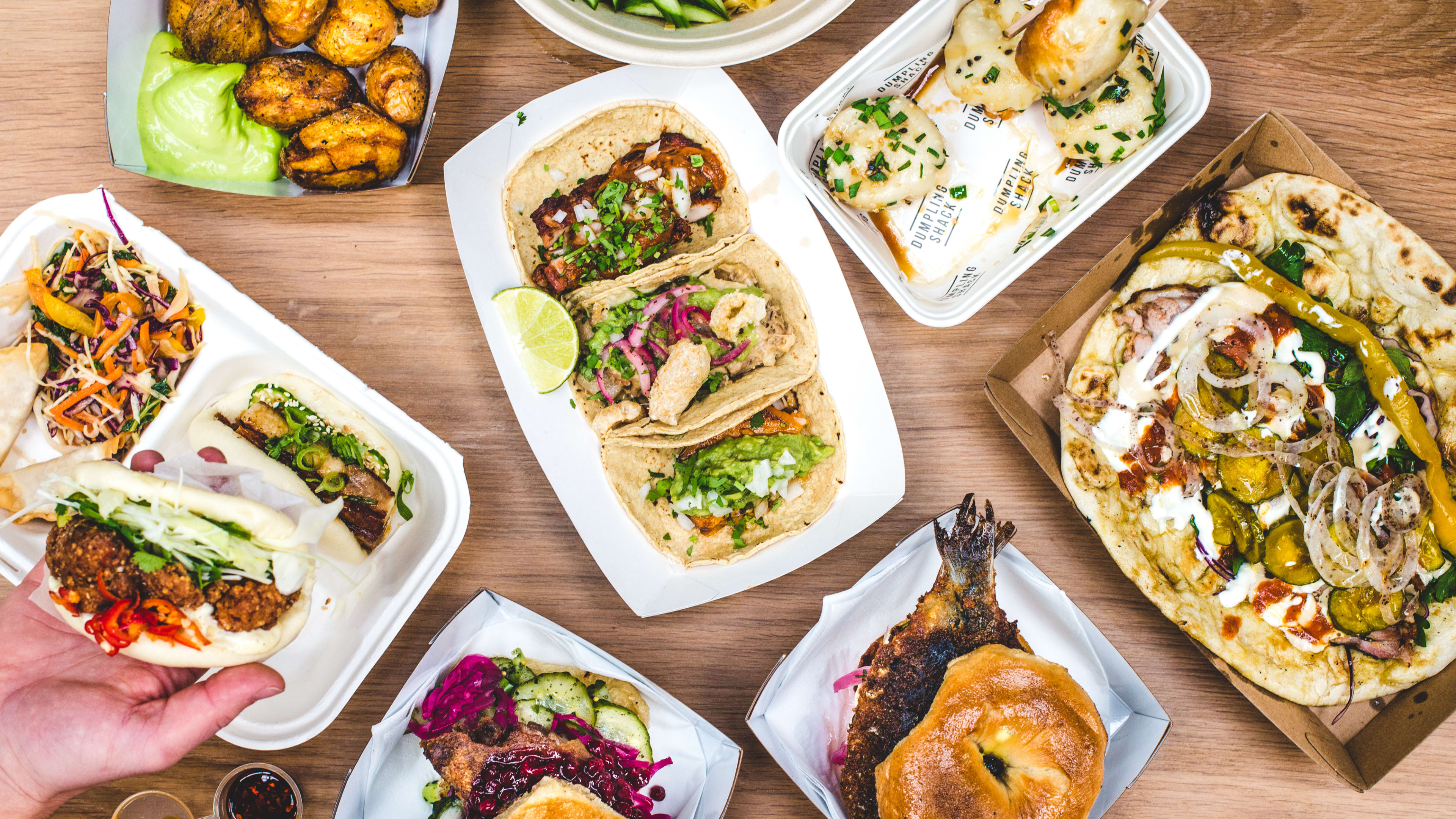 A spread of dishes from different stalls at The Kitchens At Old Spitalfields Market.