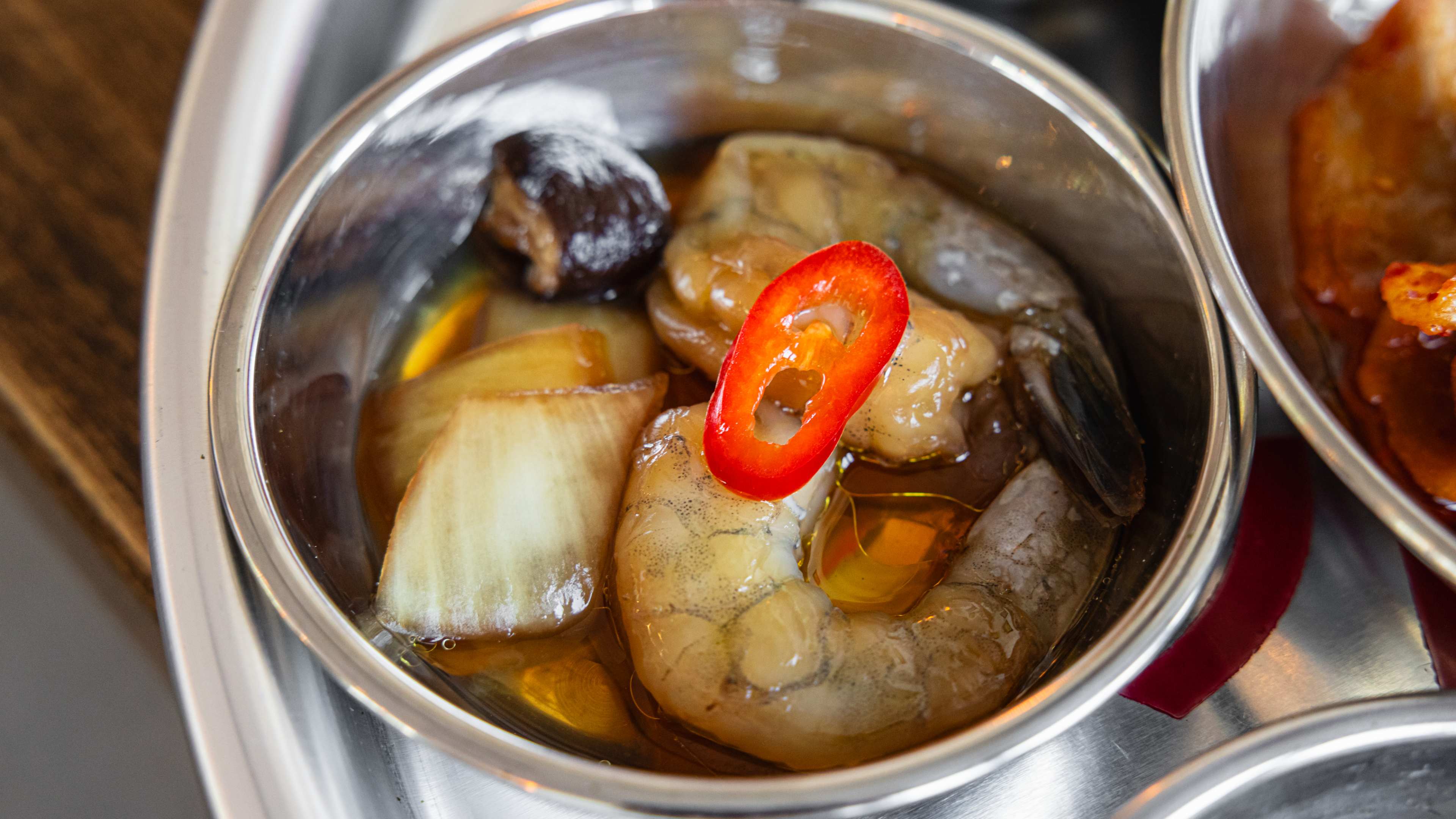 A small bowl of soy-marinated shrimp.