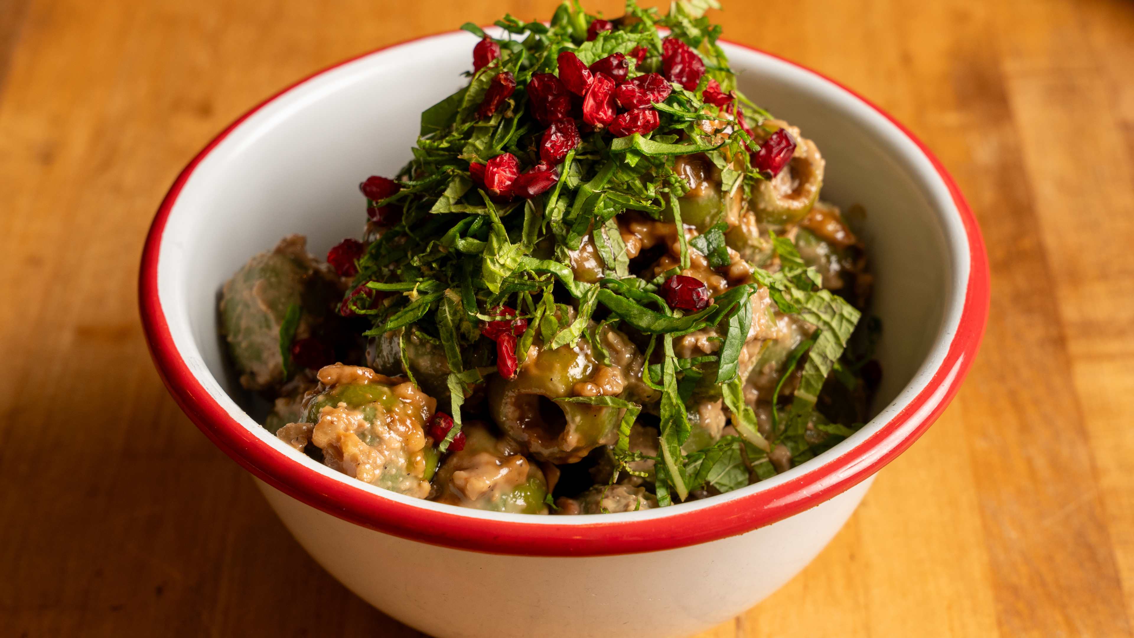 A bowl of marinated olives at Komaaj Mazze Wine Bar