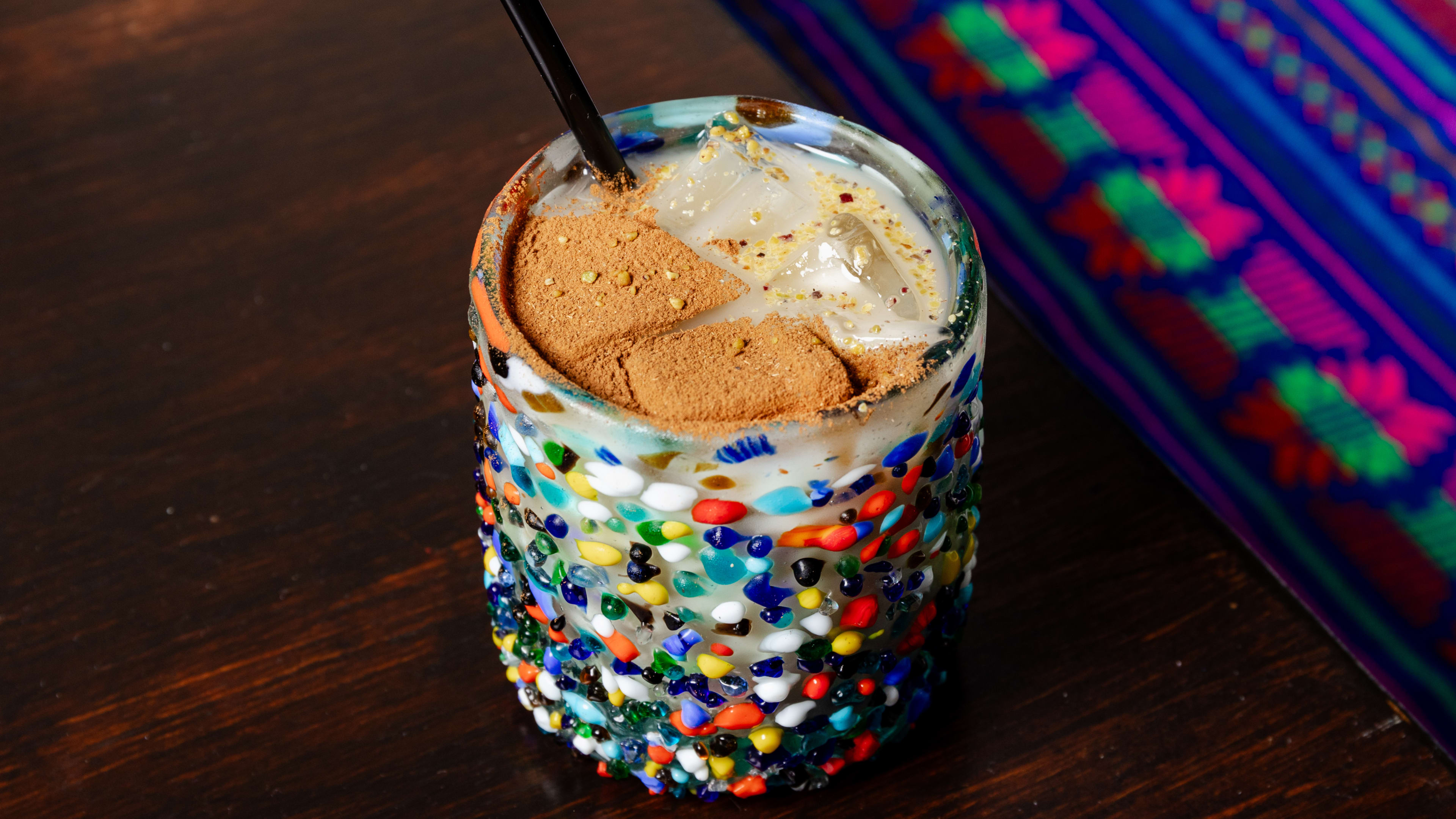 Horchata in a glass with colorful polkadots
