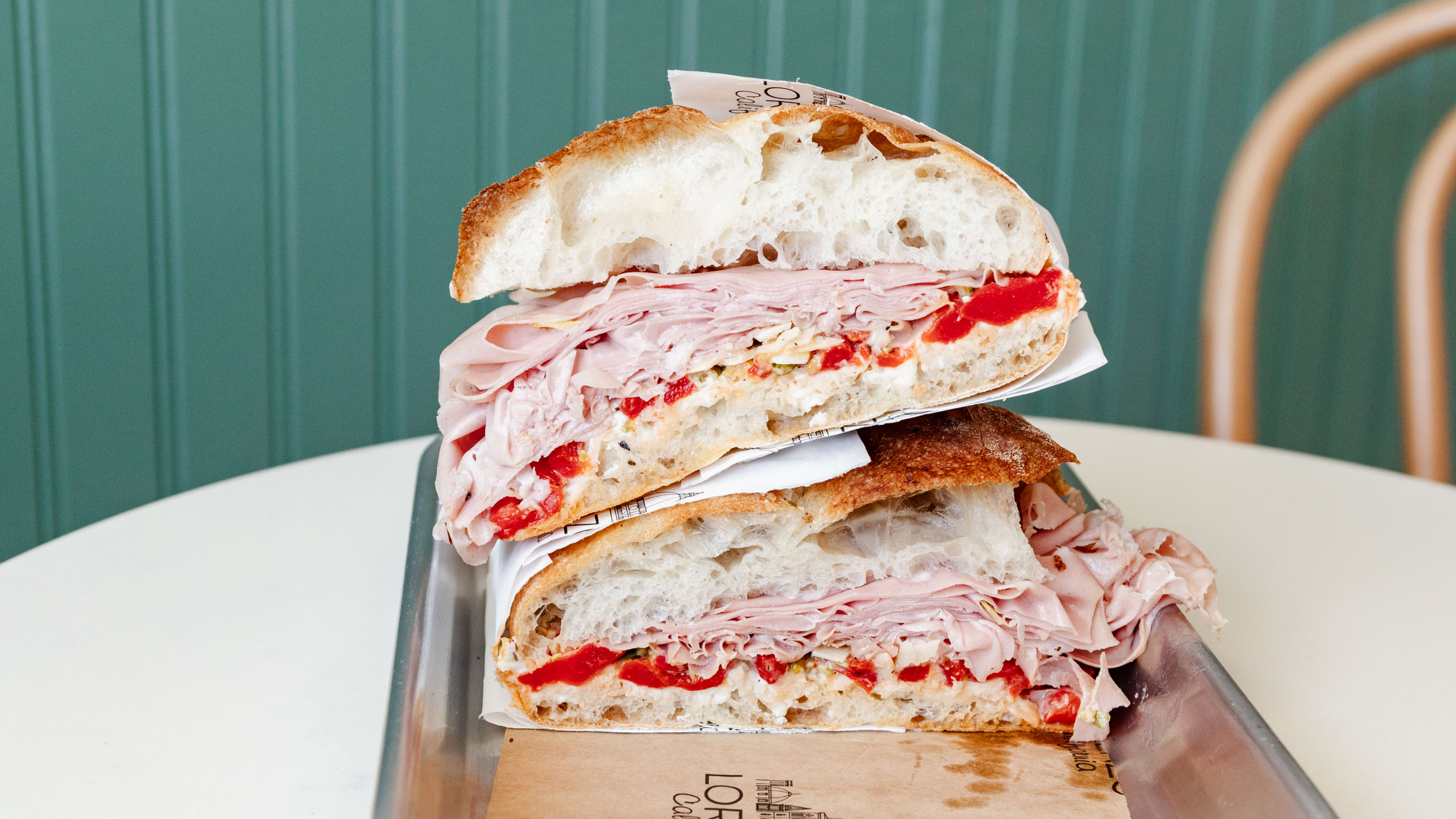 The Lorenzo Sandwich cut in half on a metal tray at Lorenzo California.