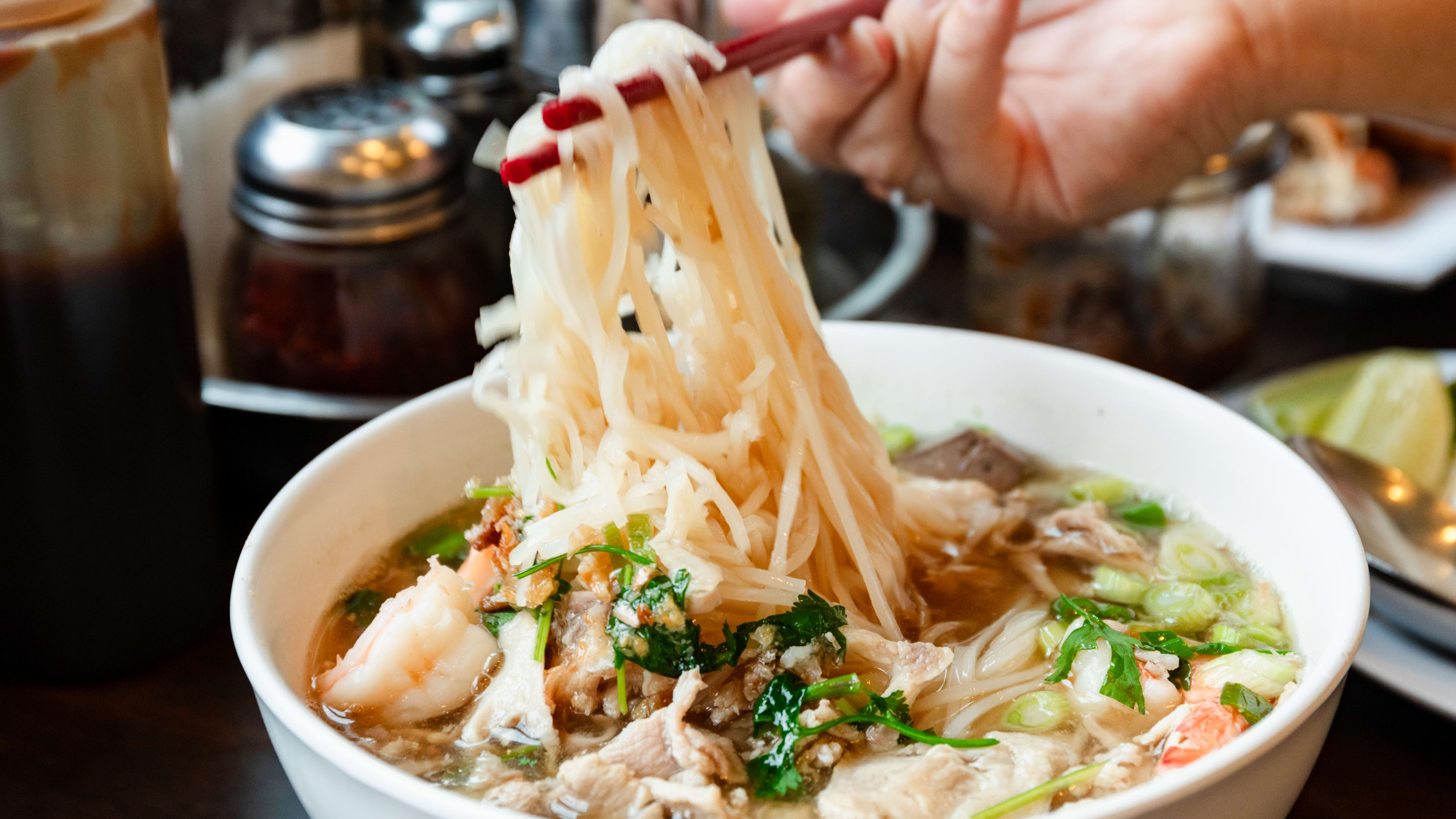 A noodle pull from a bowl of the Phnom Penh house special soup.