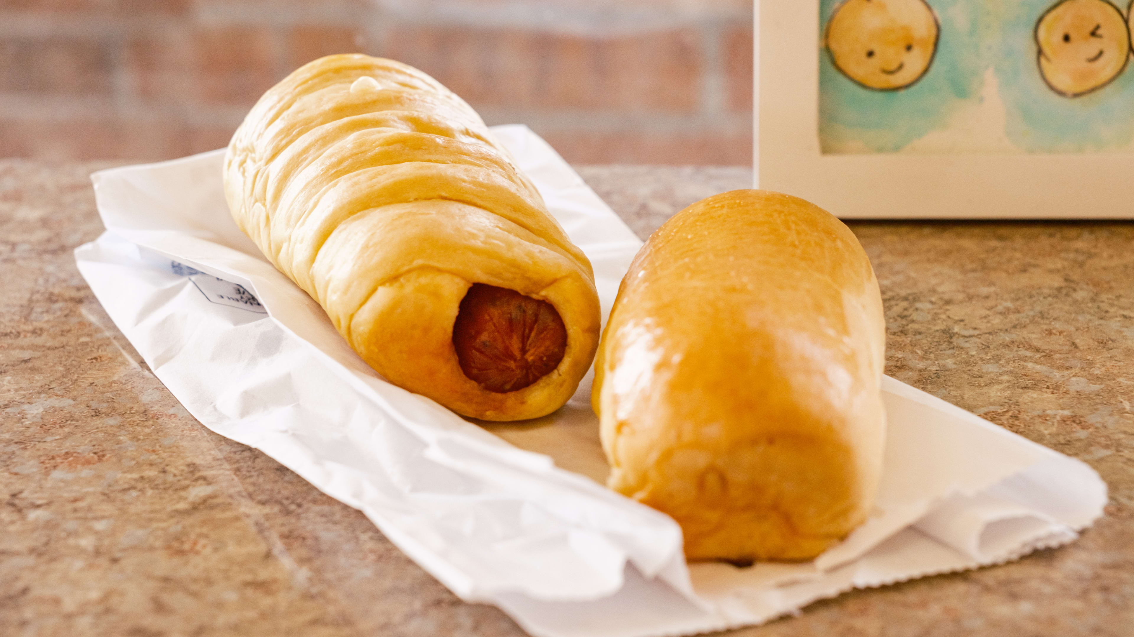 Two kolaches from Le Donut on a paper bag.