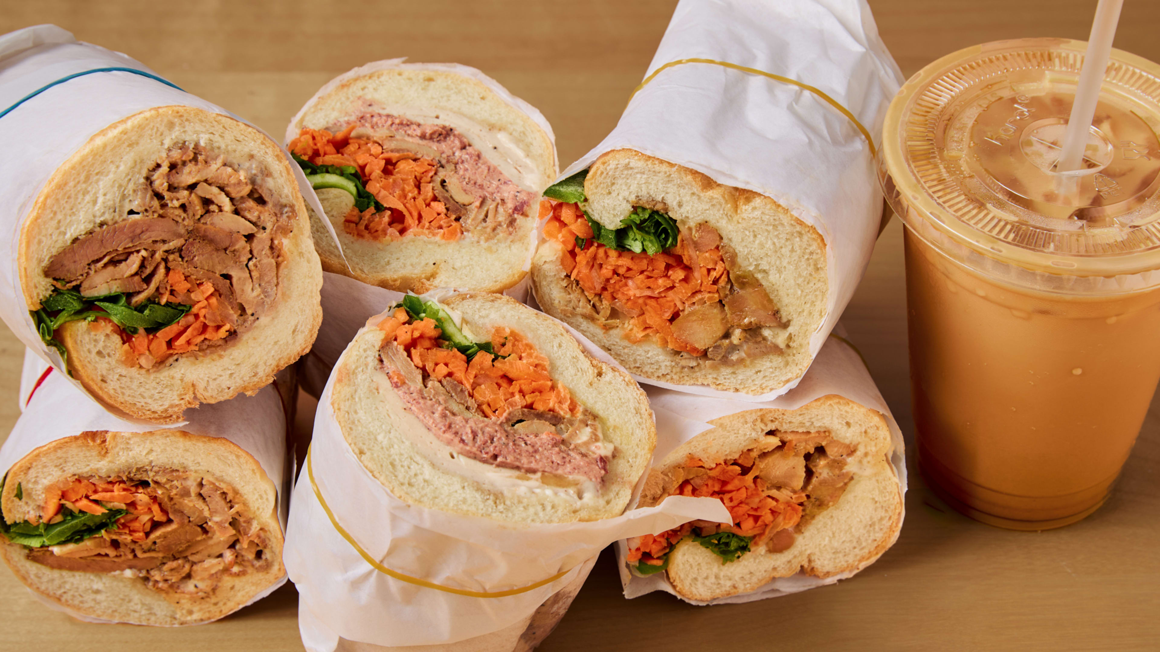 stacked banh mi halves and vietnamese iced coffee