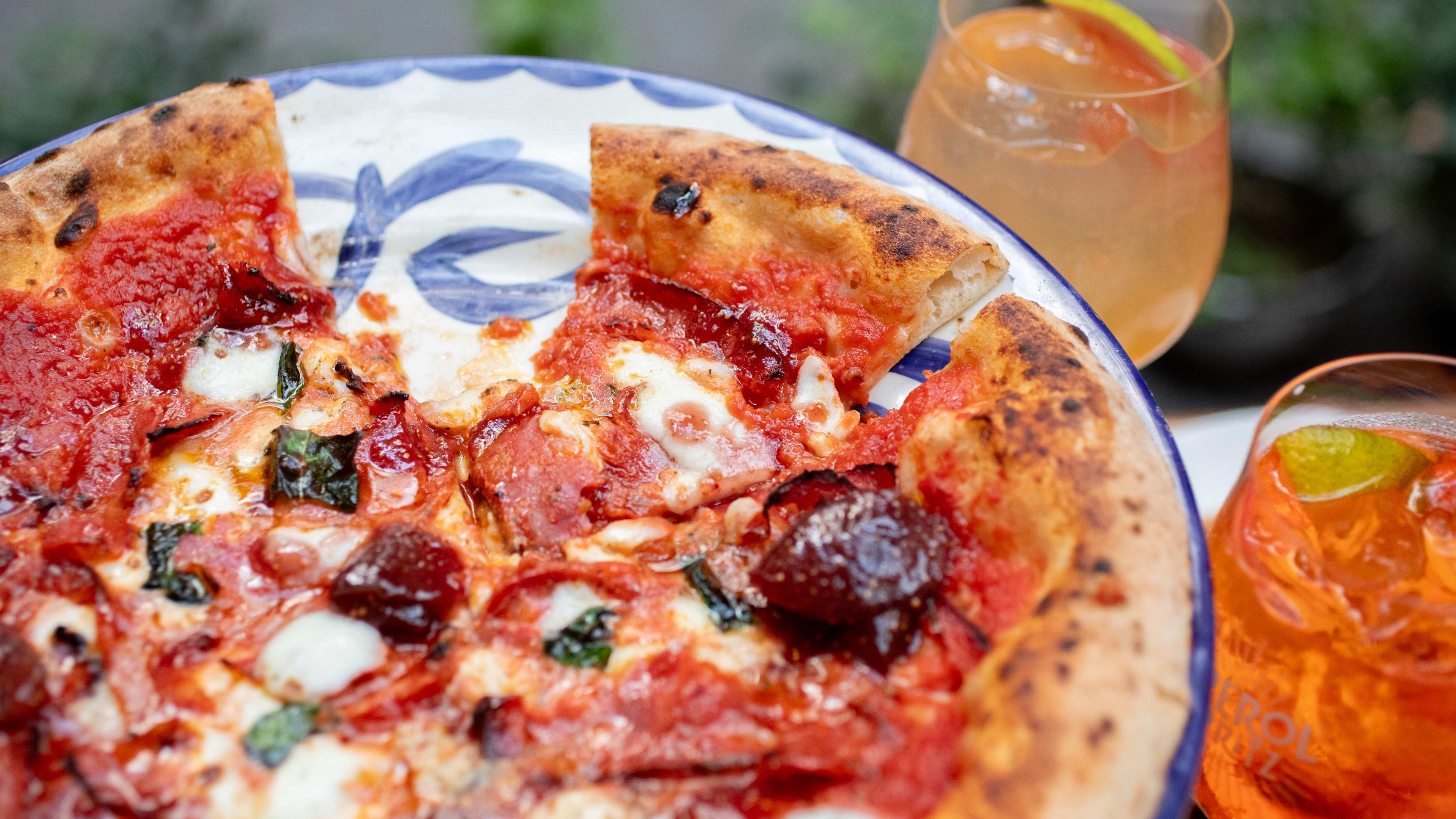 Pizza with an aperol spritz