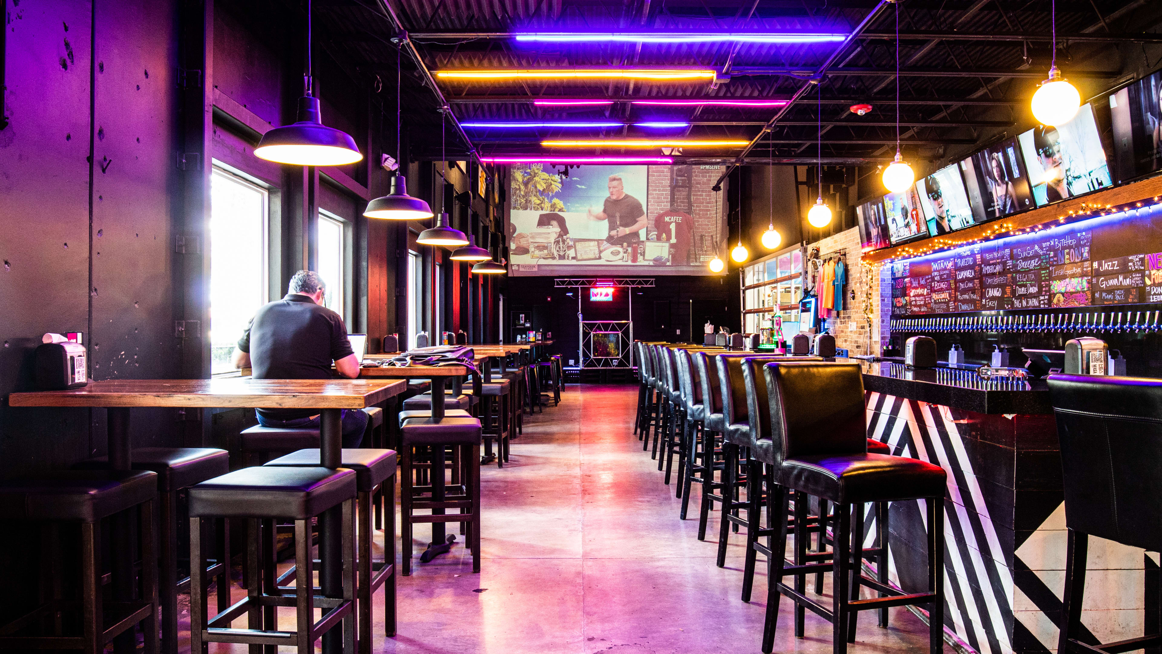 A bar with purple lighting.