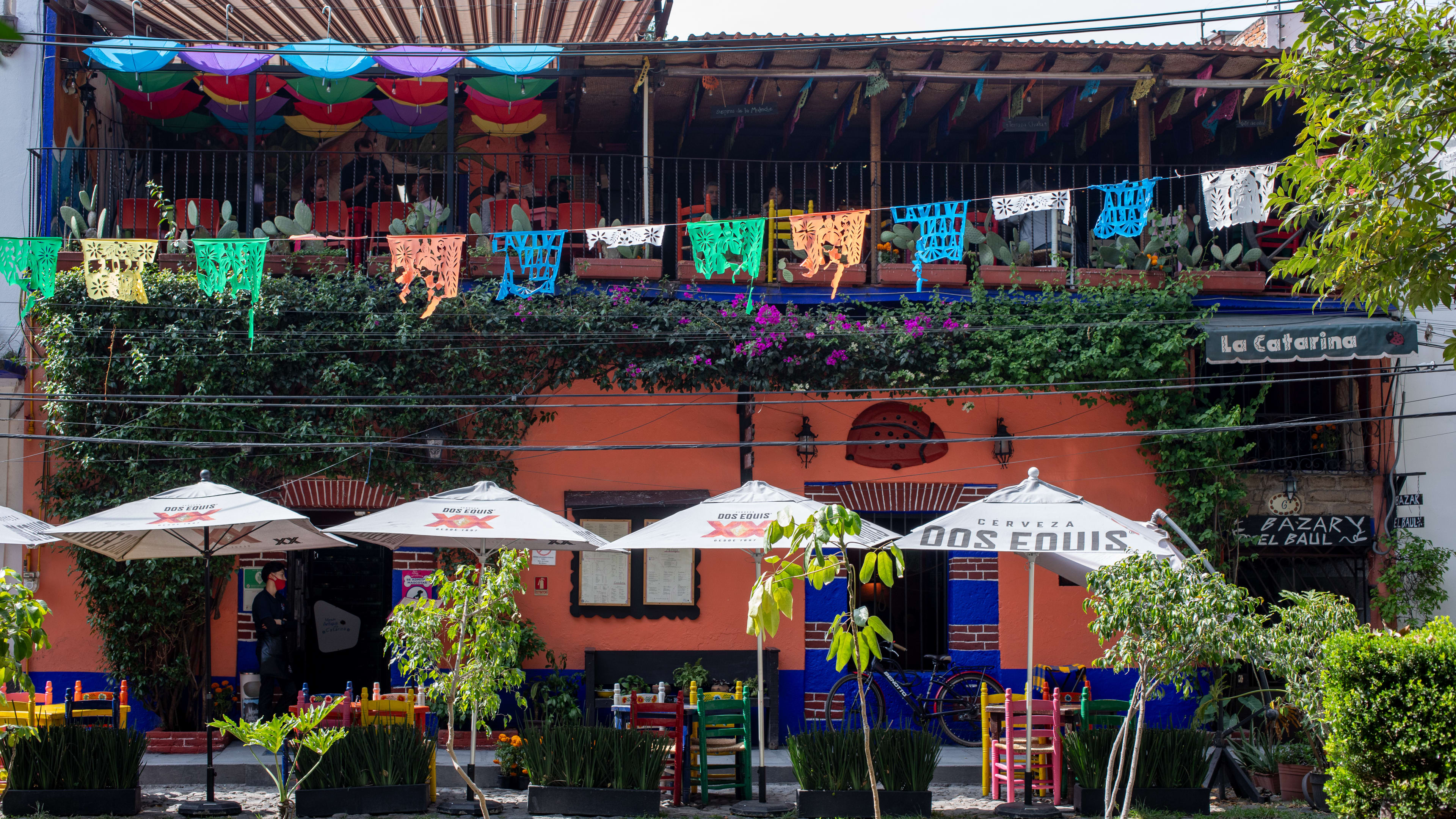 The exterior of a colorful three-story restaurant in Mexico City
