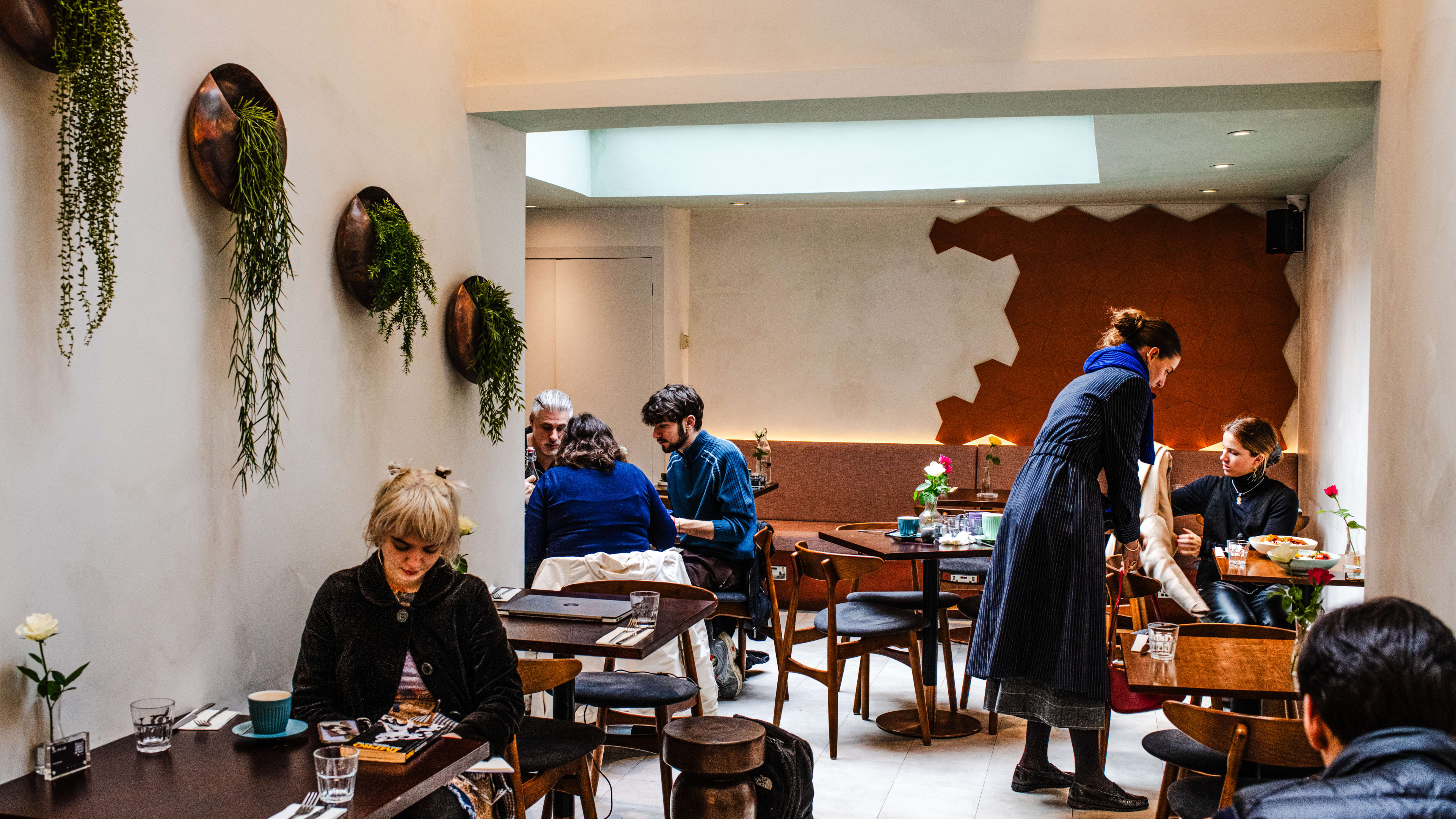 People dining in the airy interior of Counter by Naroon.