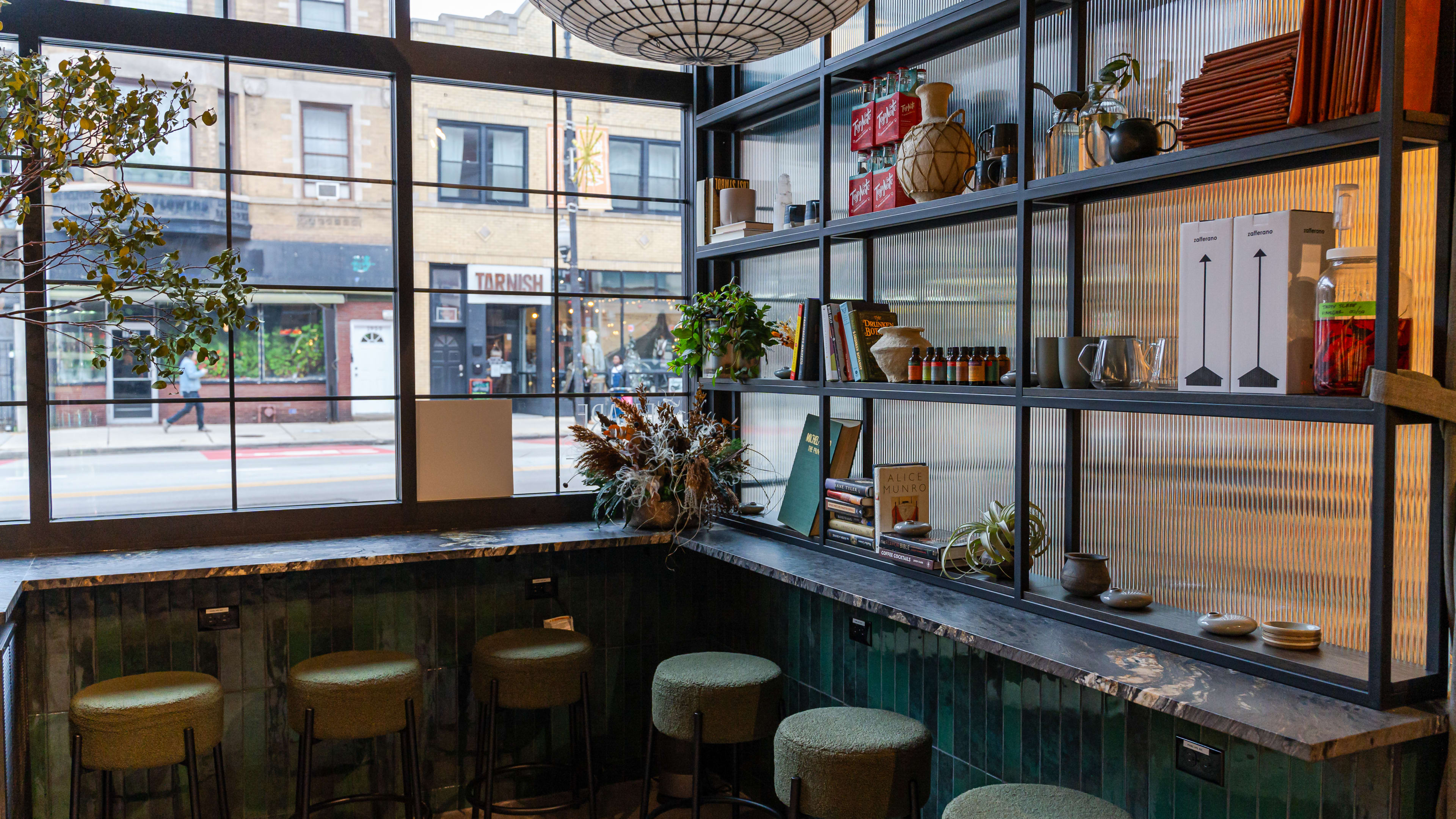 Counter seating in front of Nettare's big front windows and shelving