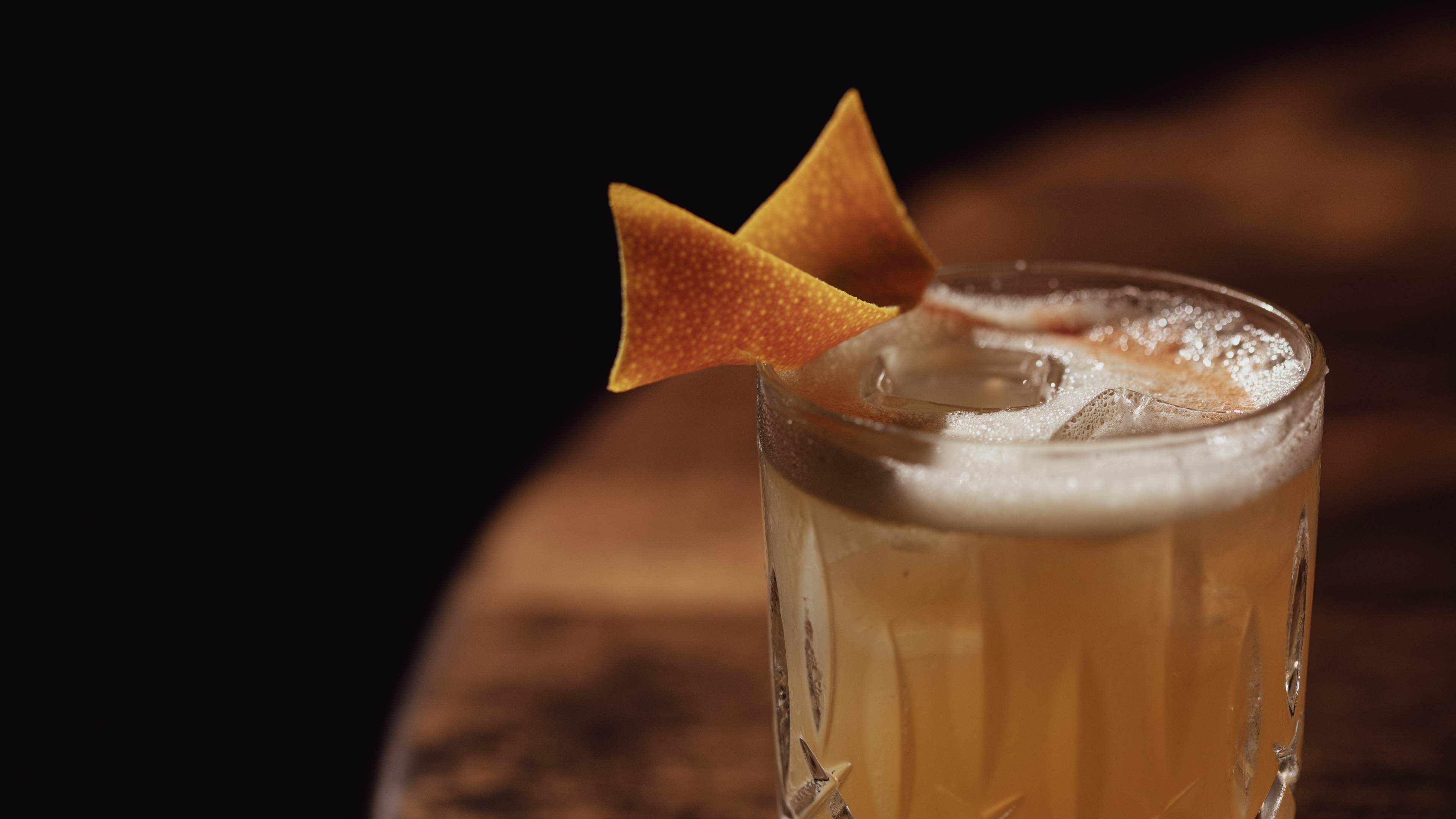 cocktail with orange peel garnish