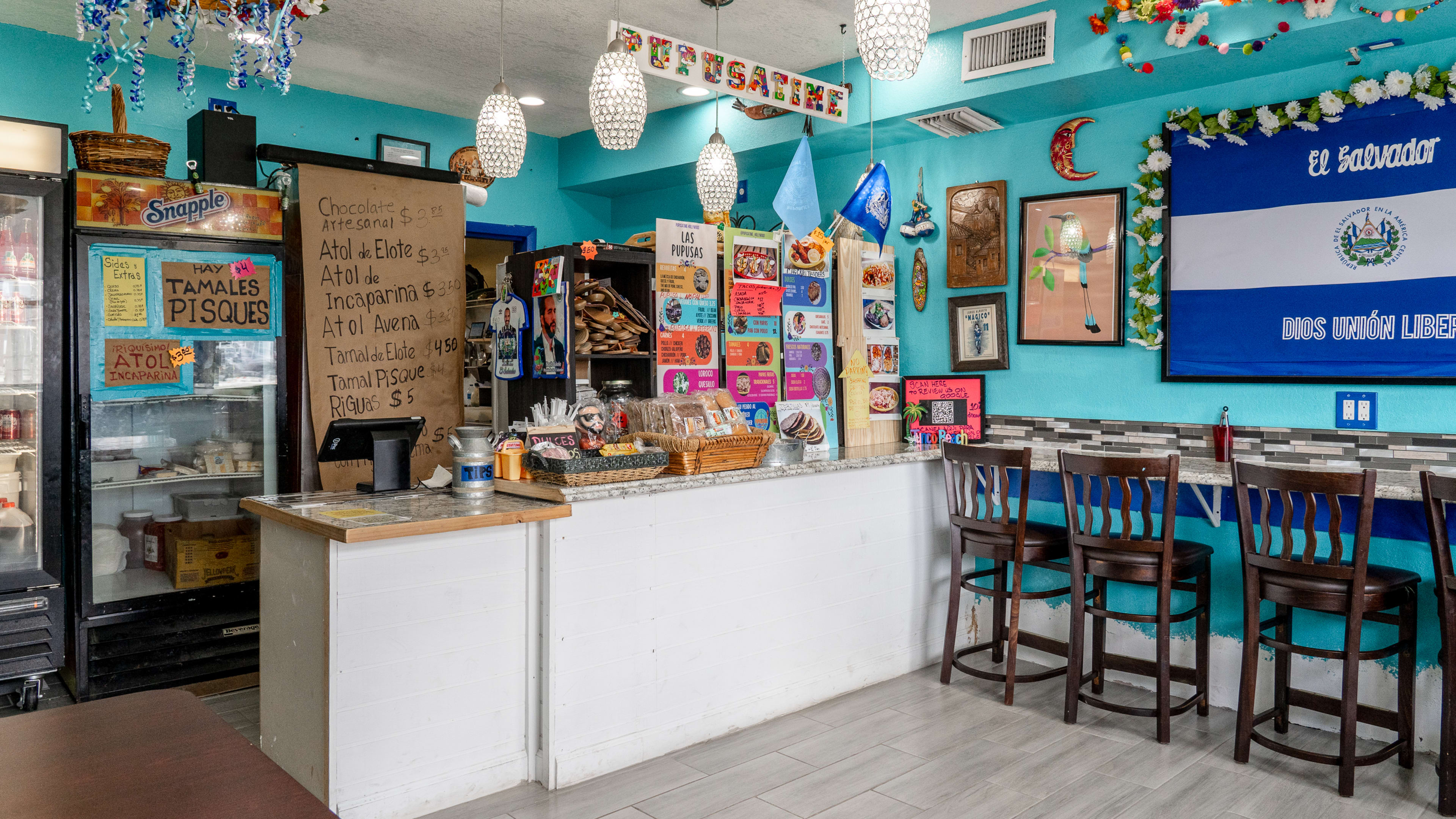 colorful interior with ordering counter and barstool seating