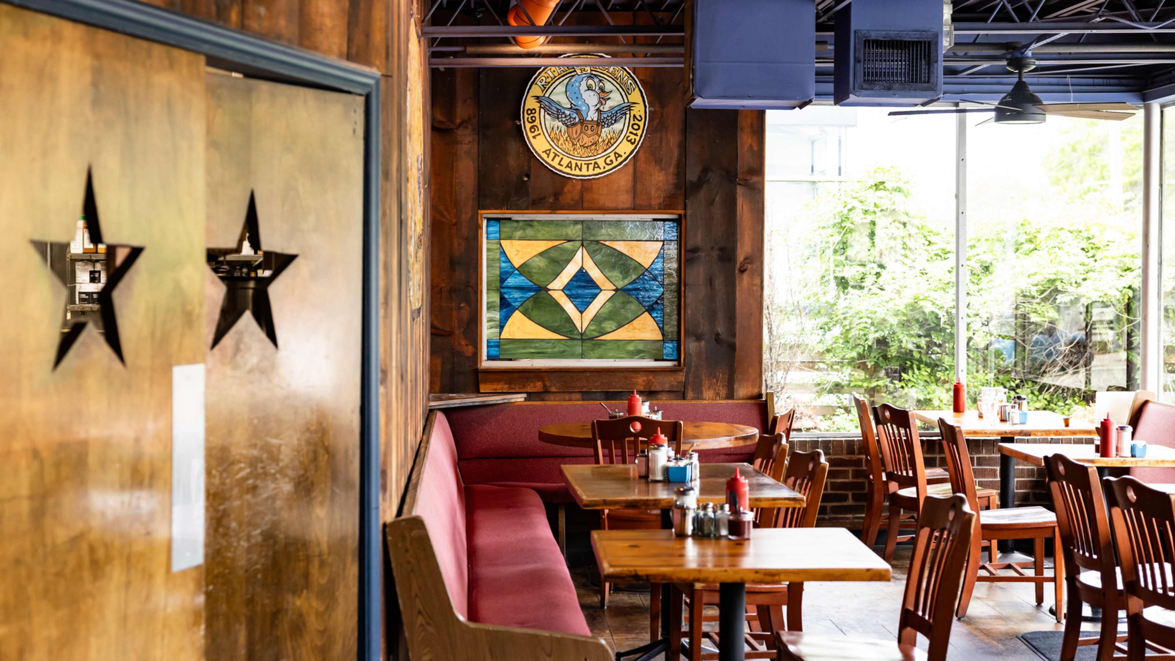 interior of brunch diner with church pew benches and art