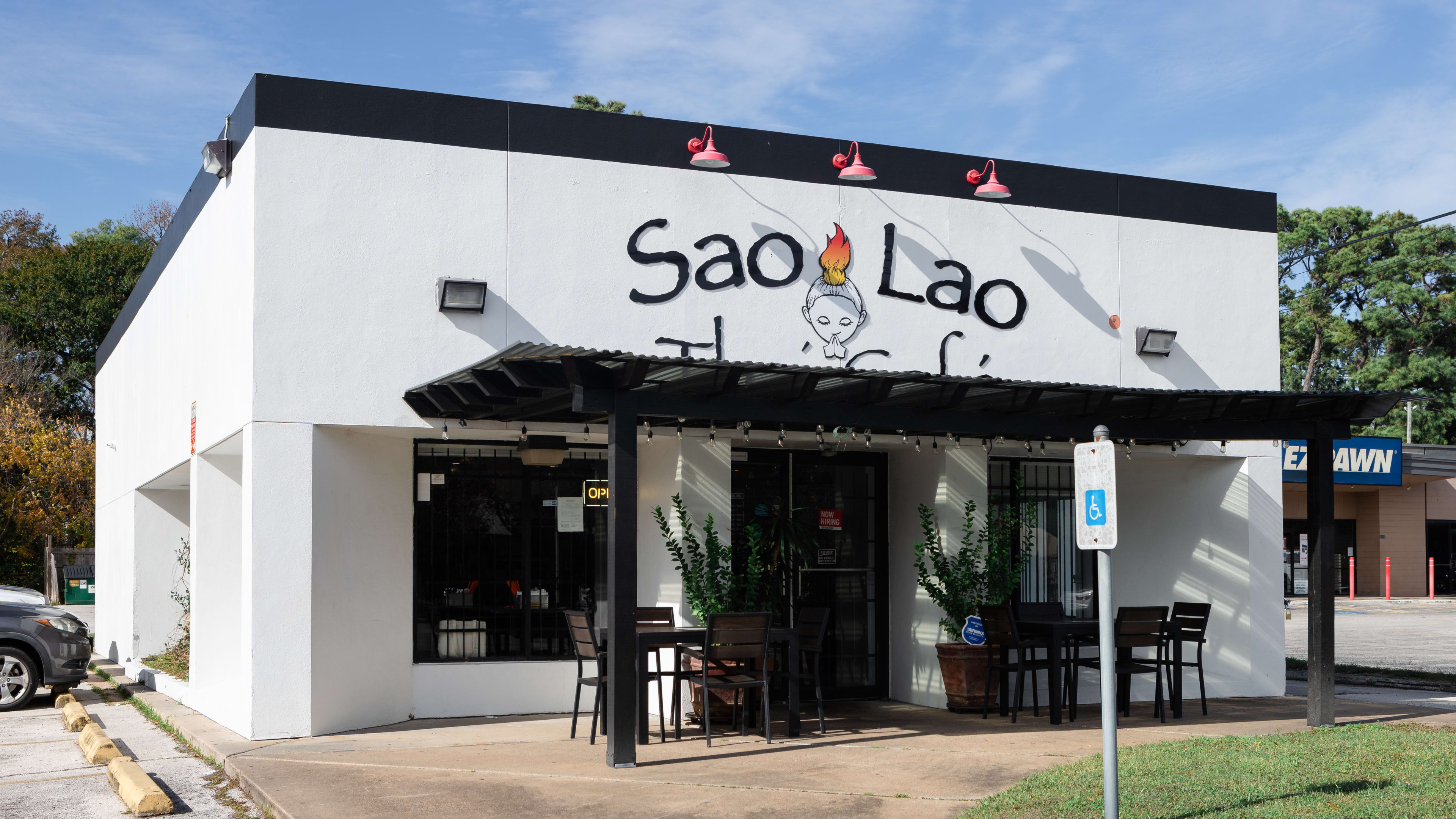 white square building with a sign reading sao lao thai cafe