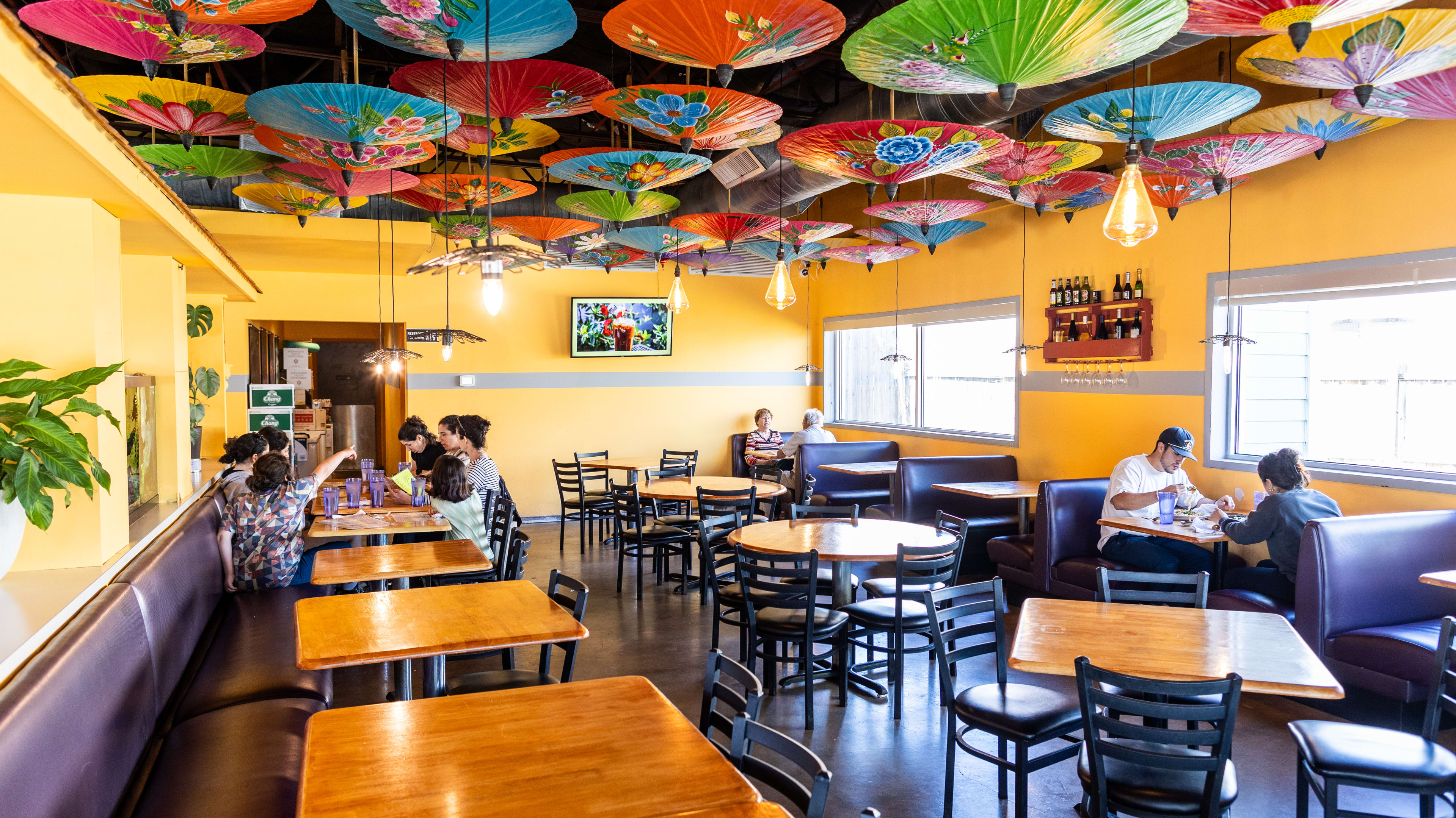 The interior of Sap’s Fine Thai Cuisine. Thai traditional colorful umbrellas hang from the ceiling.