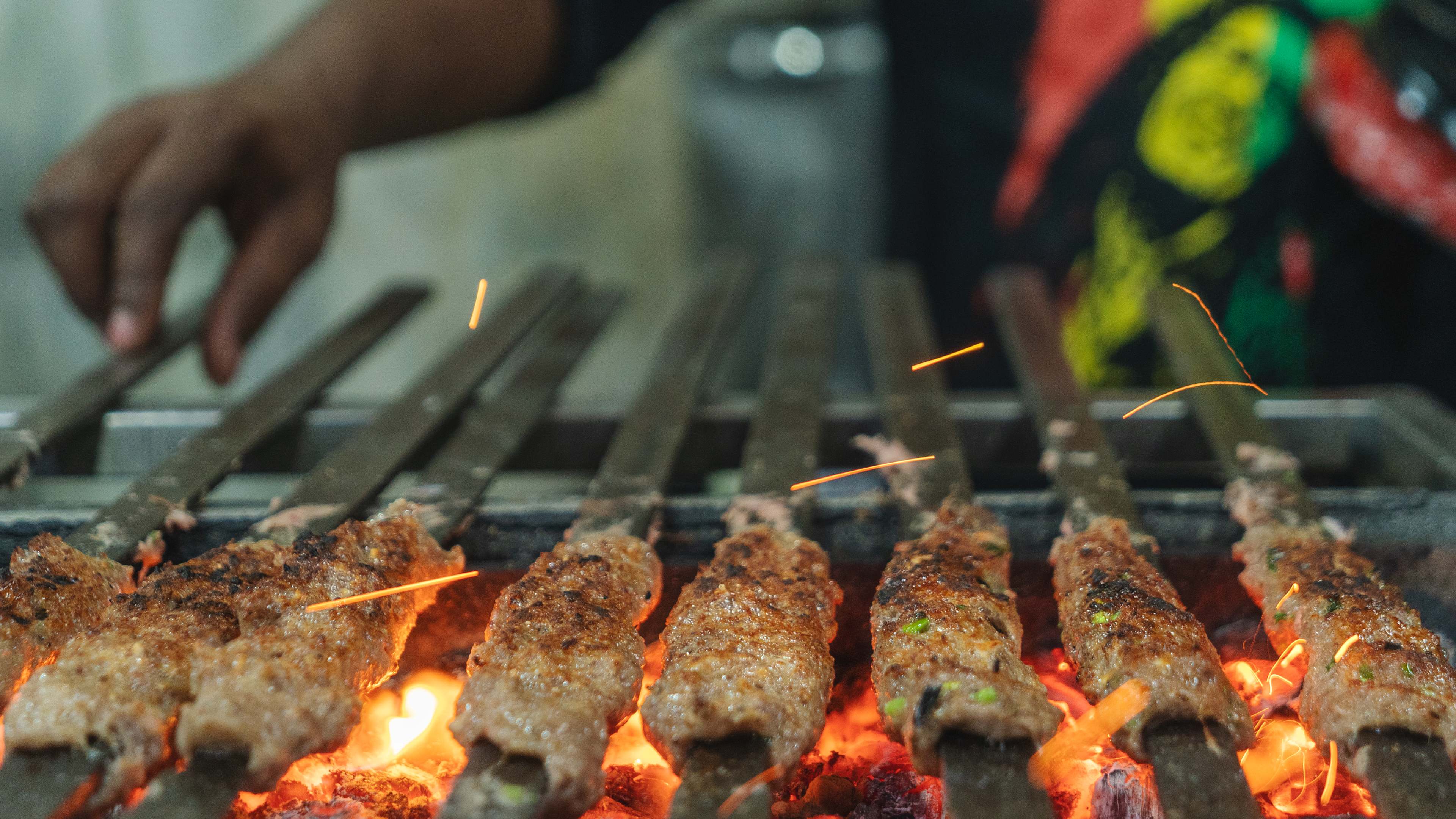 Kebabs grilling over an open flame at Sarvi