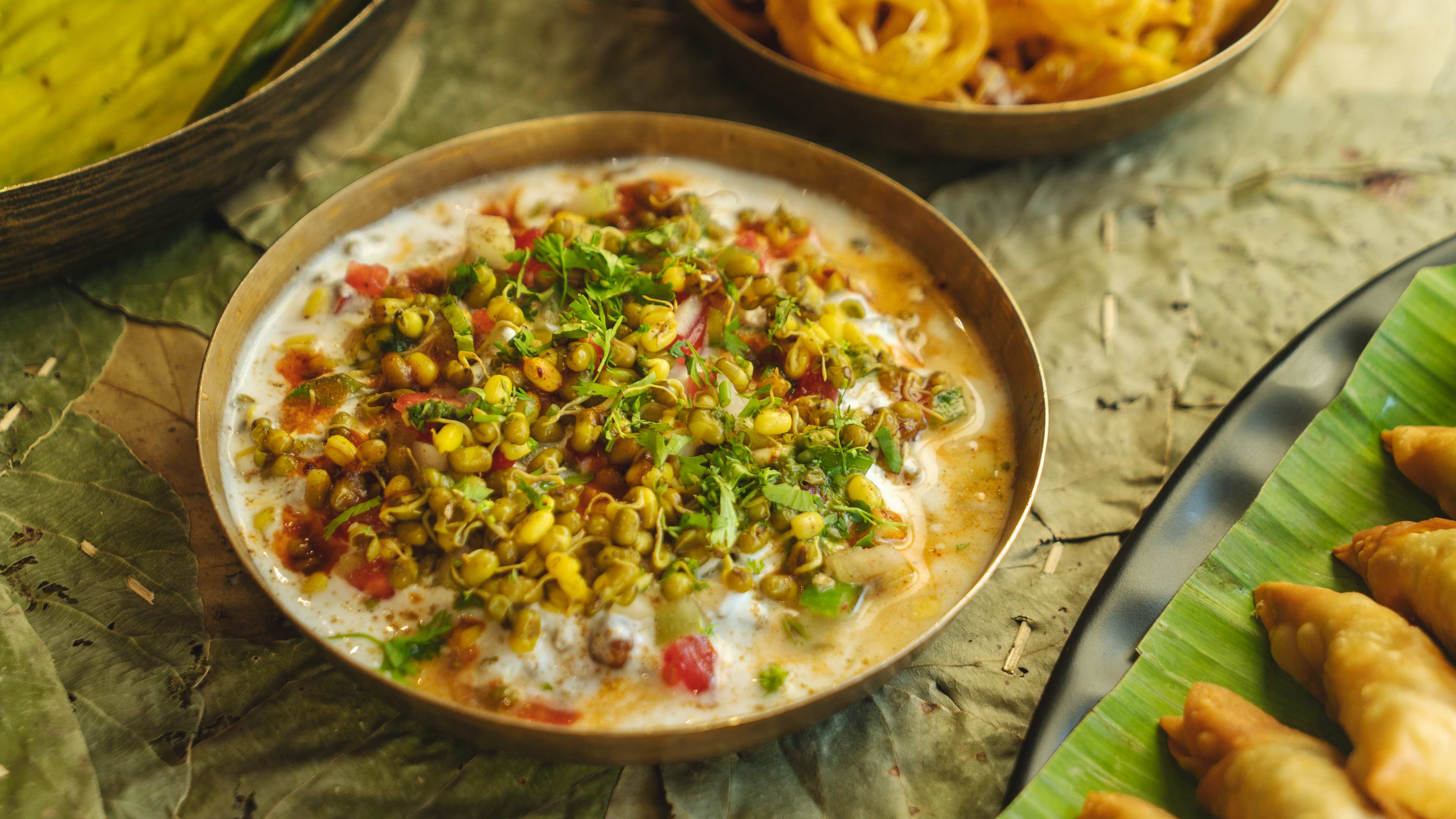 Vitamin Bhel with plate of samosas at Soam