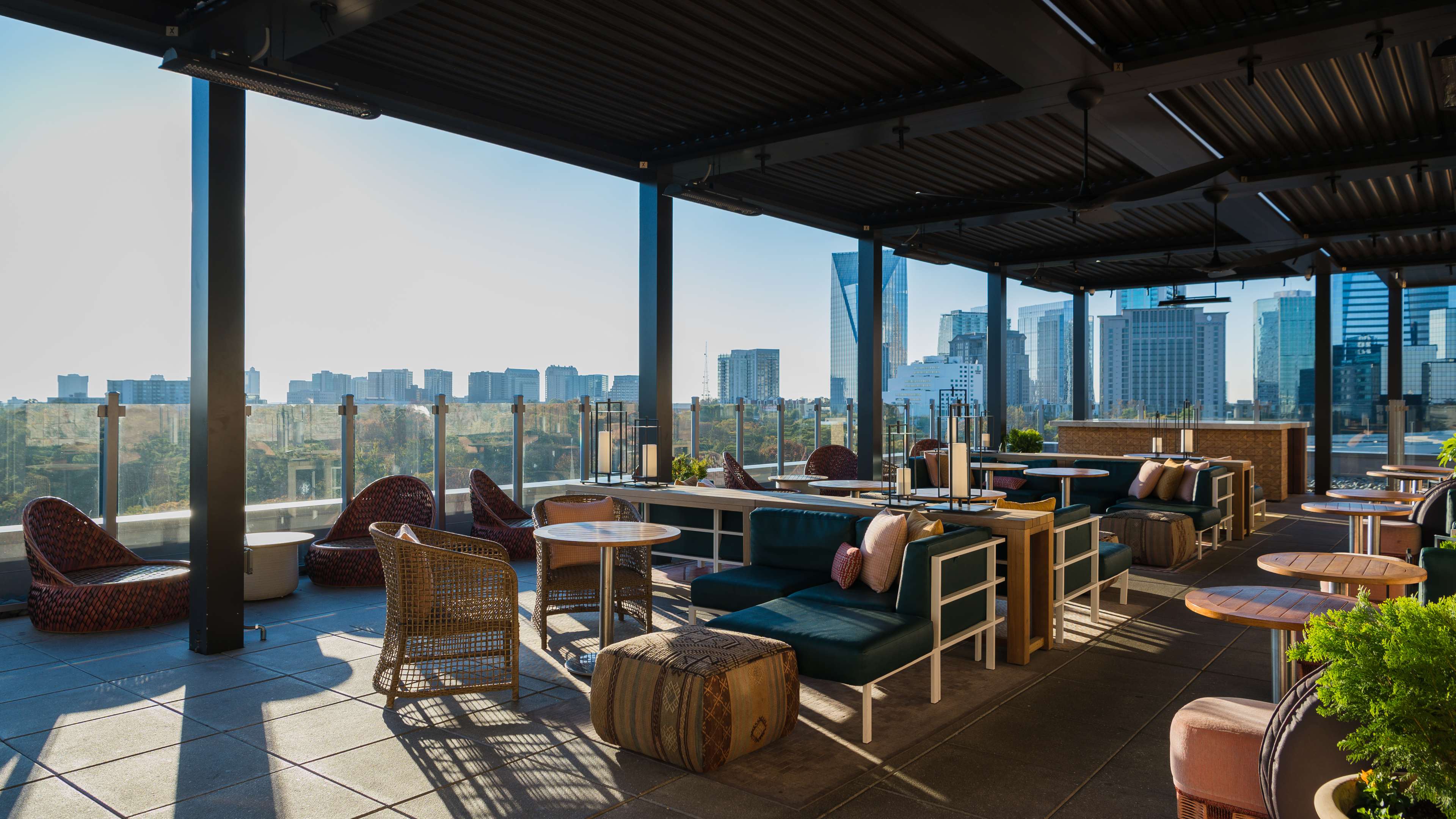 A rooftop patio overlooking tall Buckhead buildings.