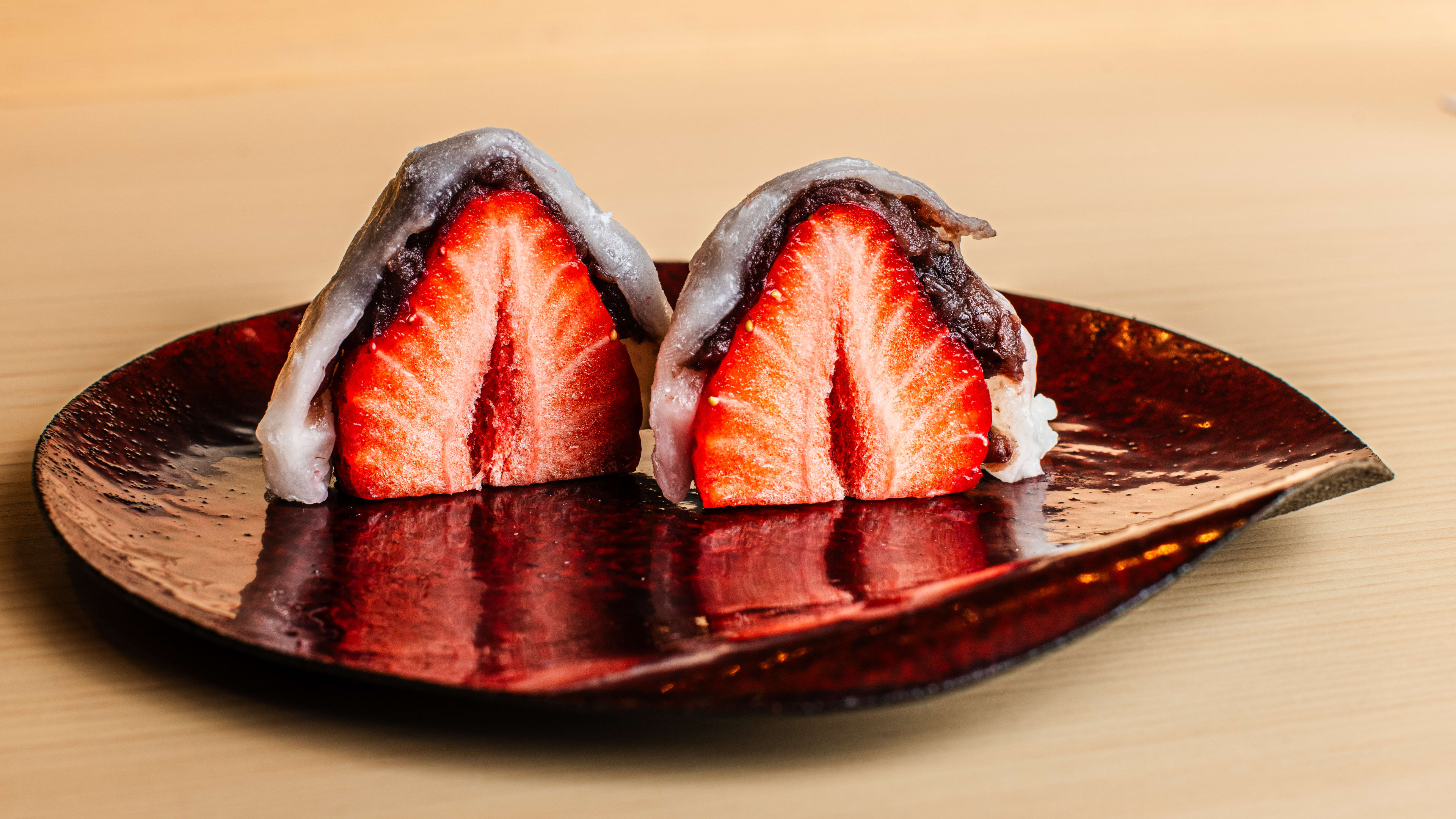 A red leaf shaped plate of daifuku.