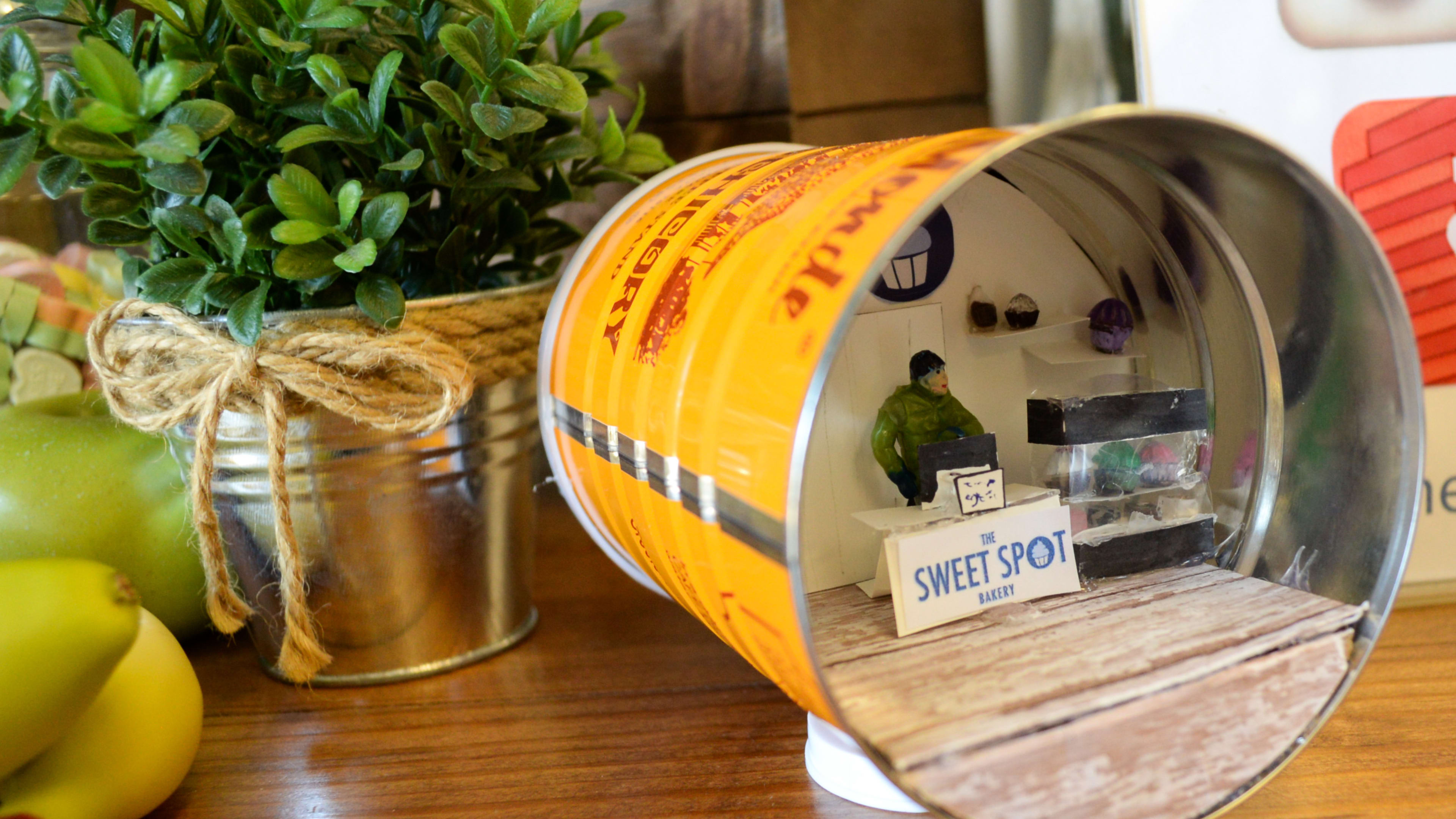 Minature model of a bakery inside a coffee can