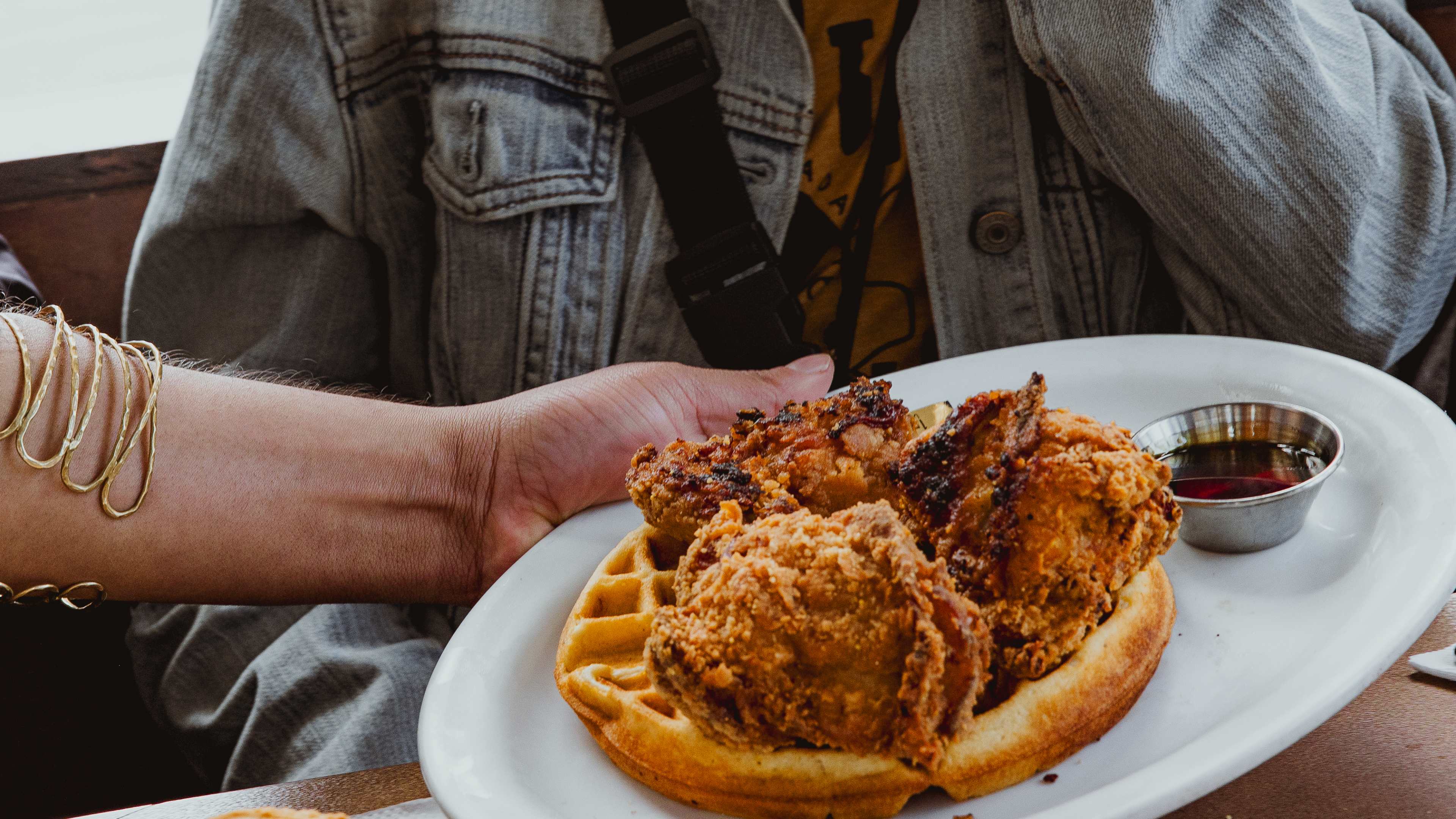 chicken and waffles with little cup for syrup