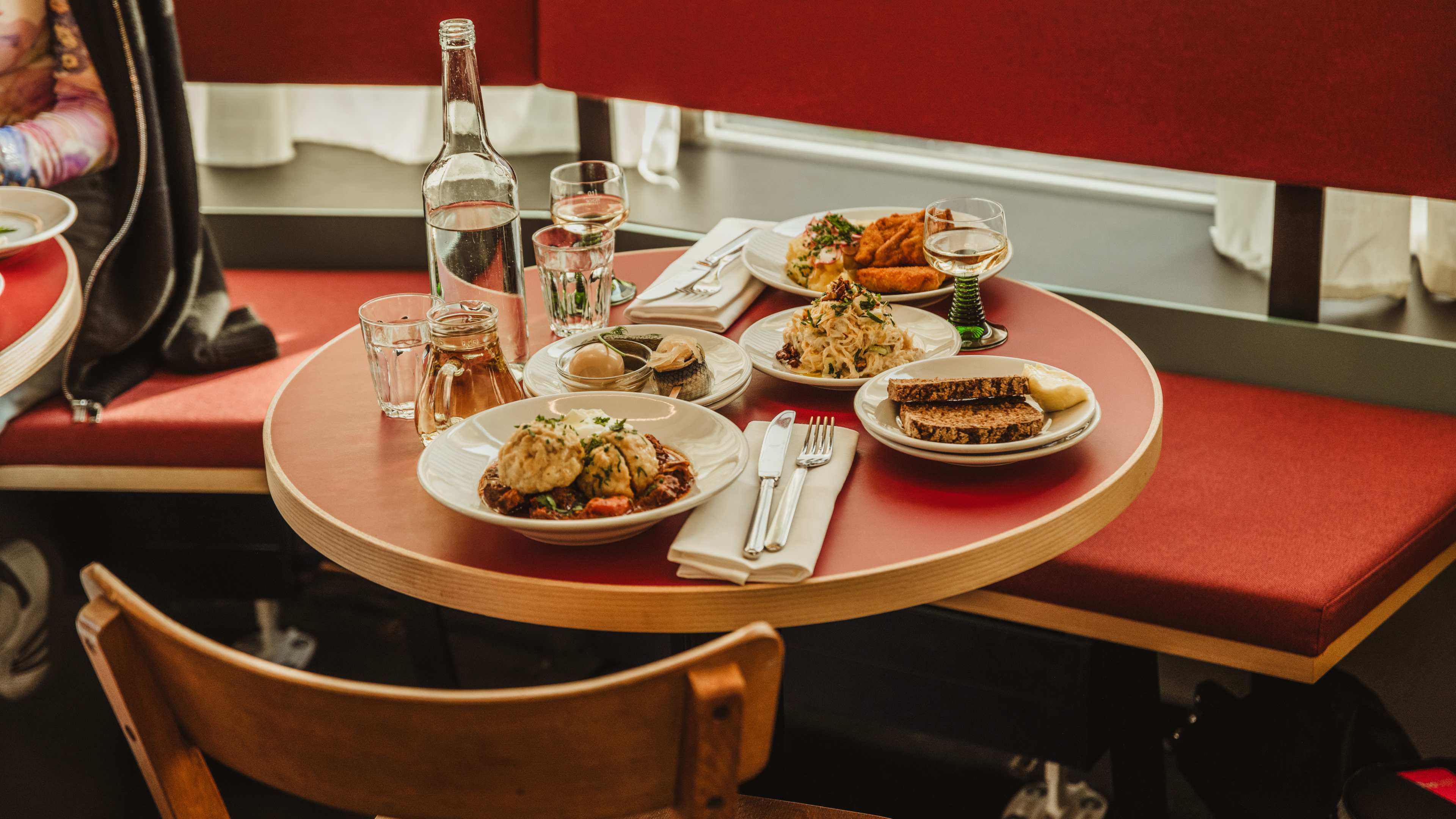 Spread of food on red table at Trio