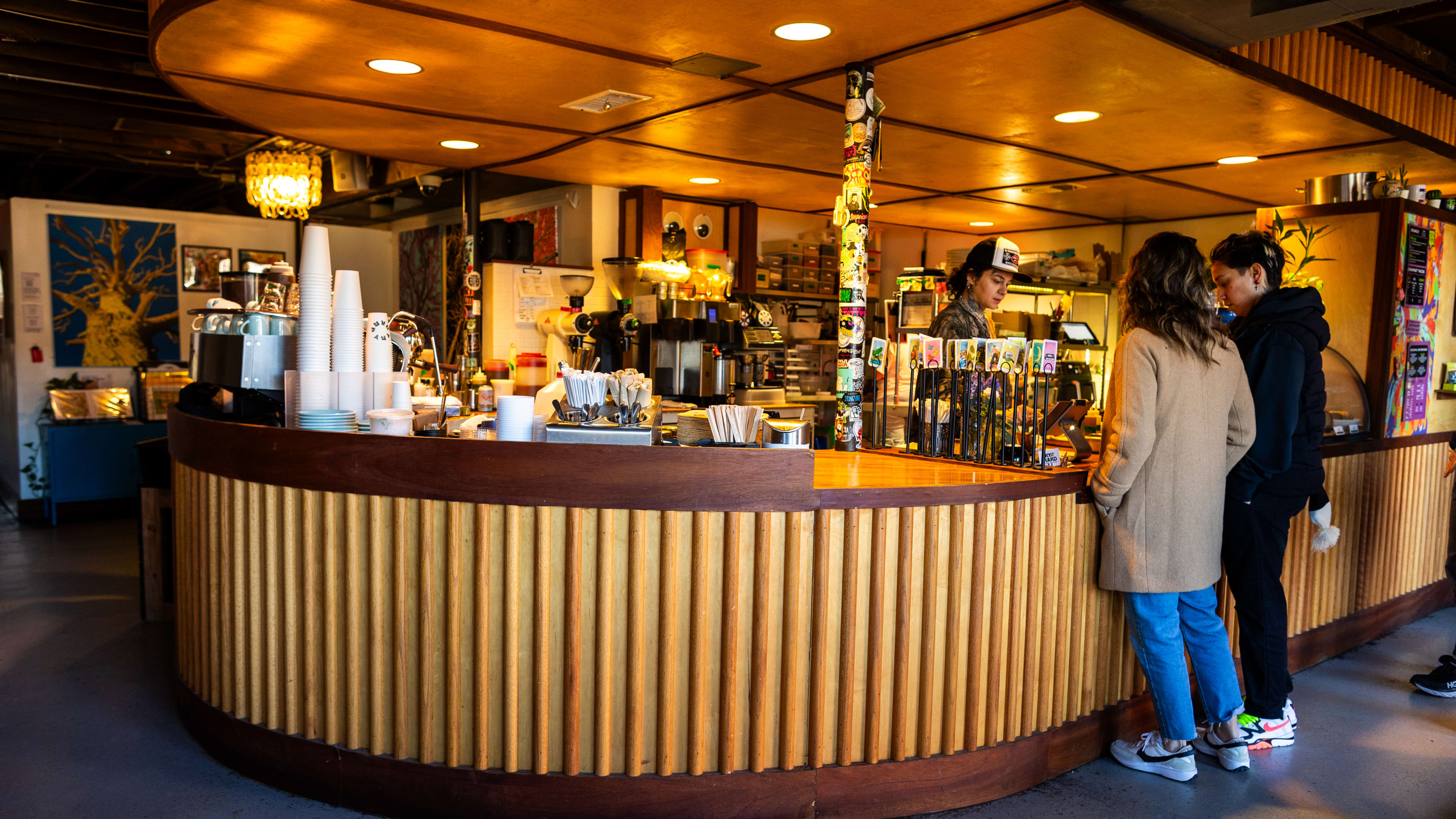 The rounded wooden coffee counter at Try Hard Coffee.