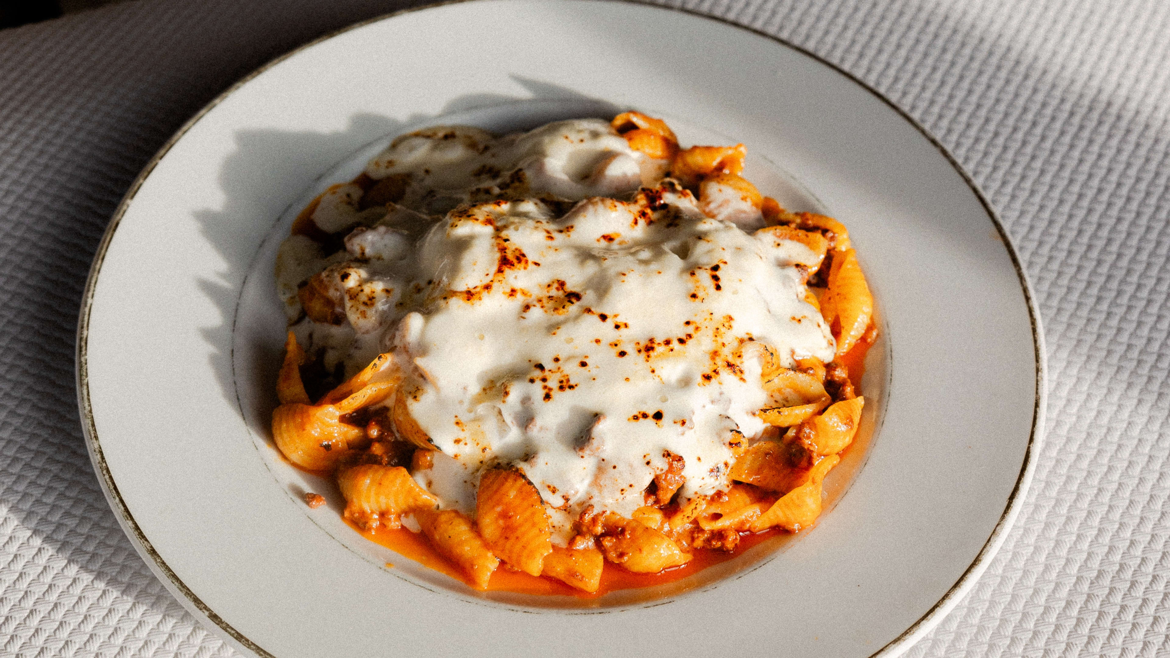 Plate of tagliatelle with red sauce and creamy soft cheese to top at Vecchio