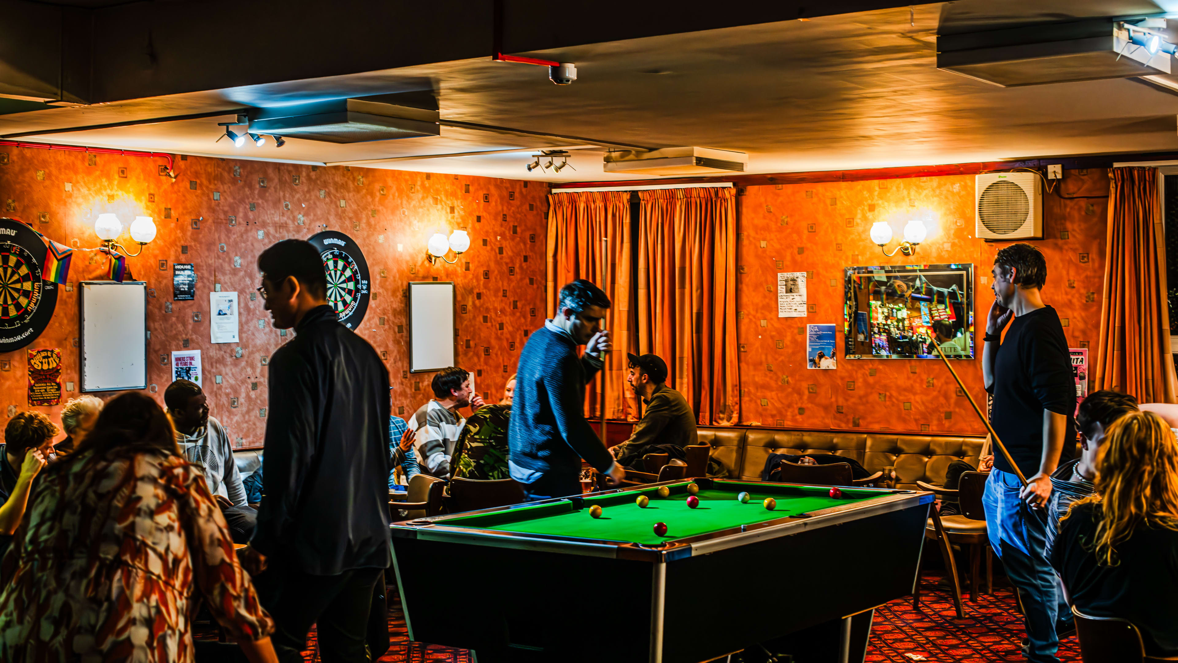 People playing pool inside Walthamstow Trades Hall