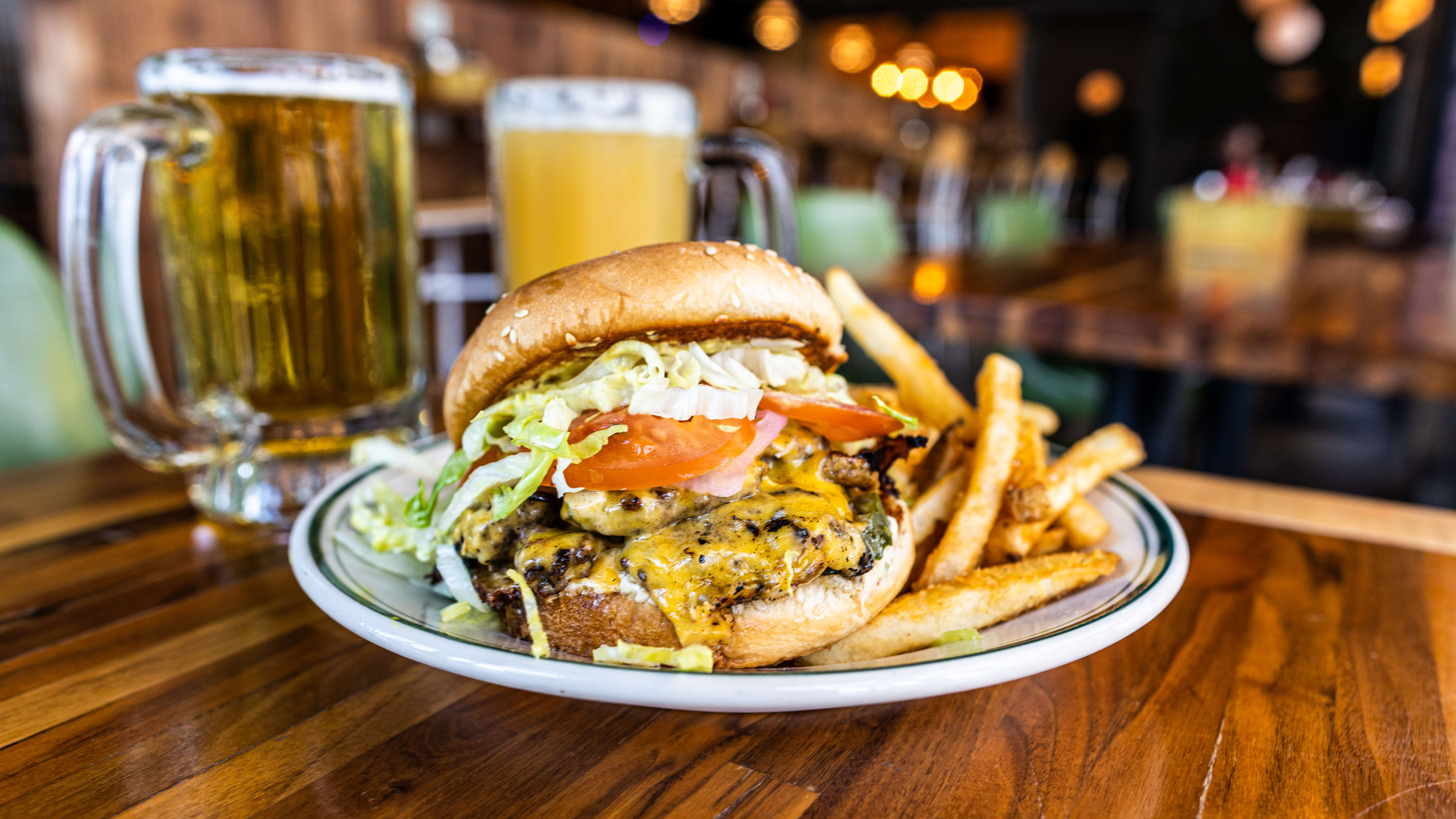 cheeseburger with fries and a pint of beer