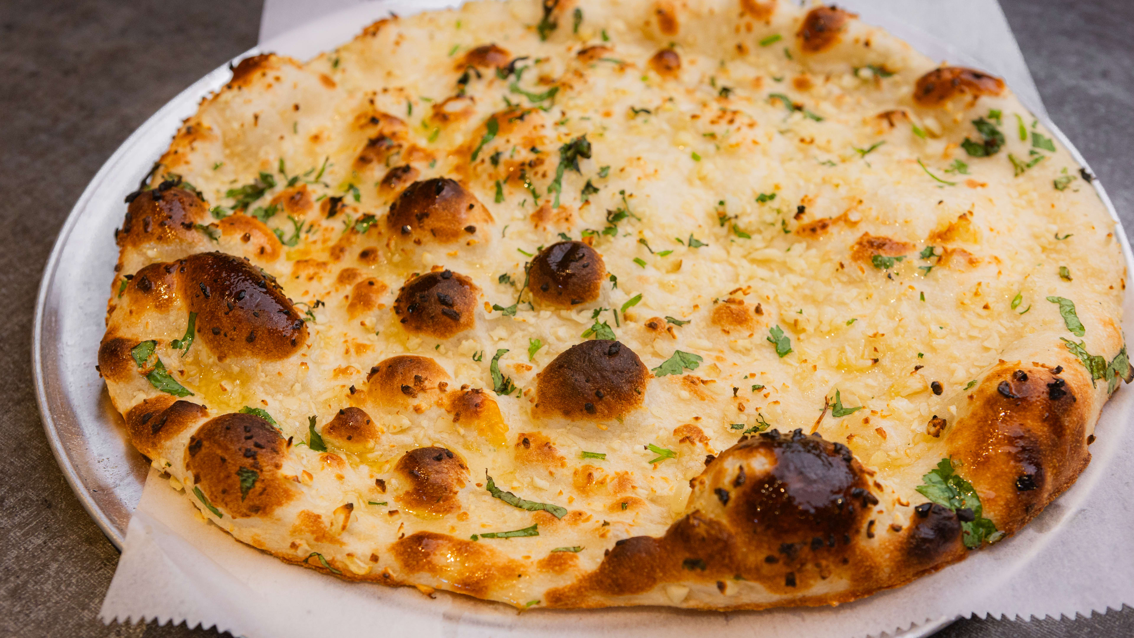 garlic naan on a plate