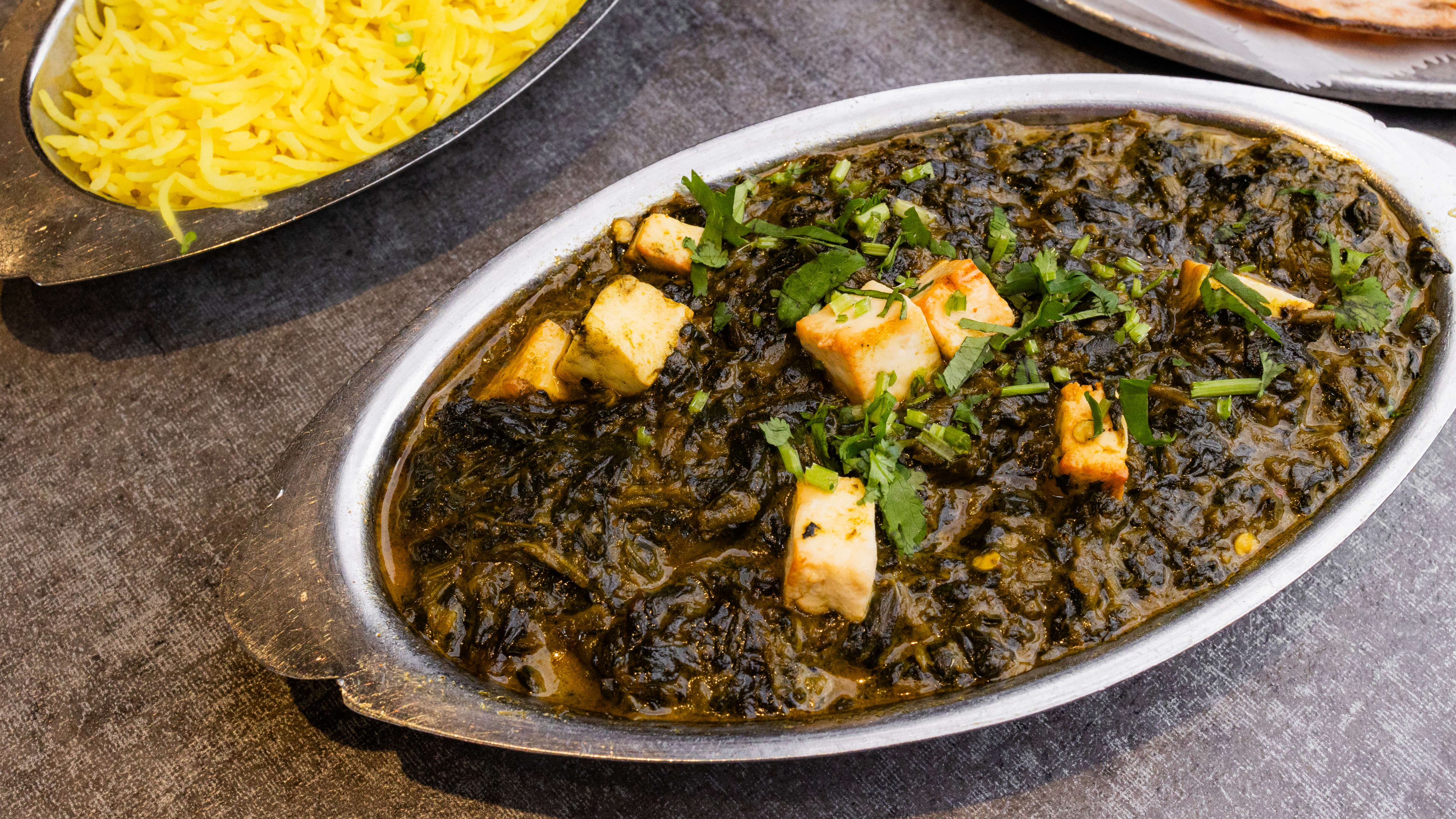 palak paneer in tin dish