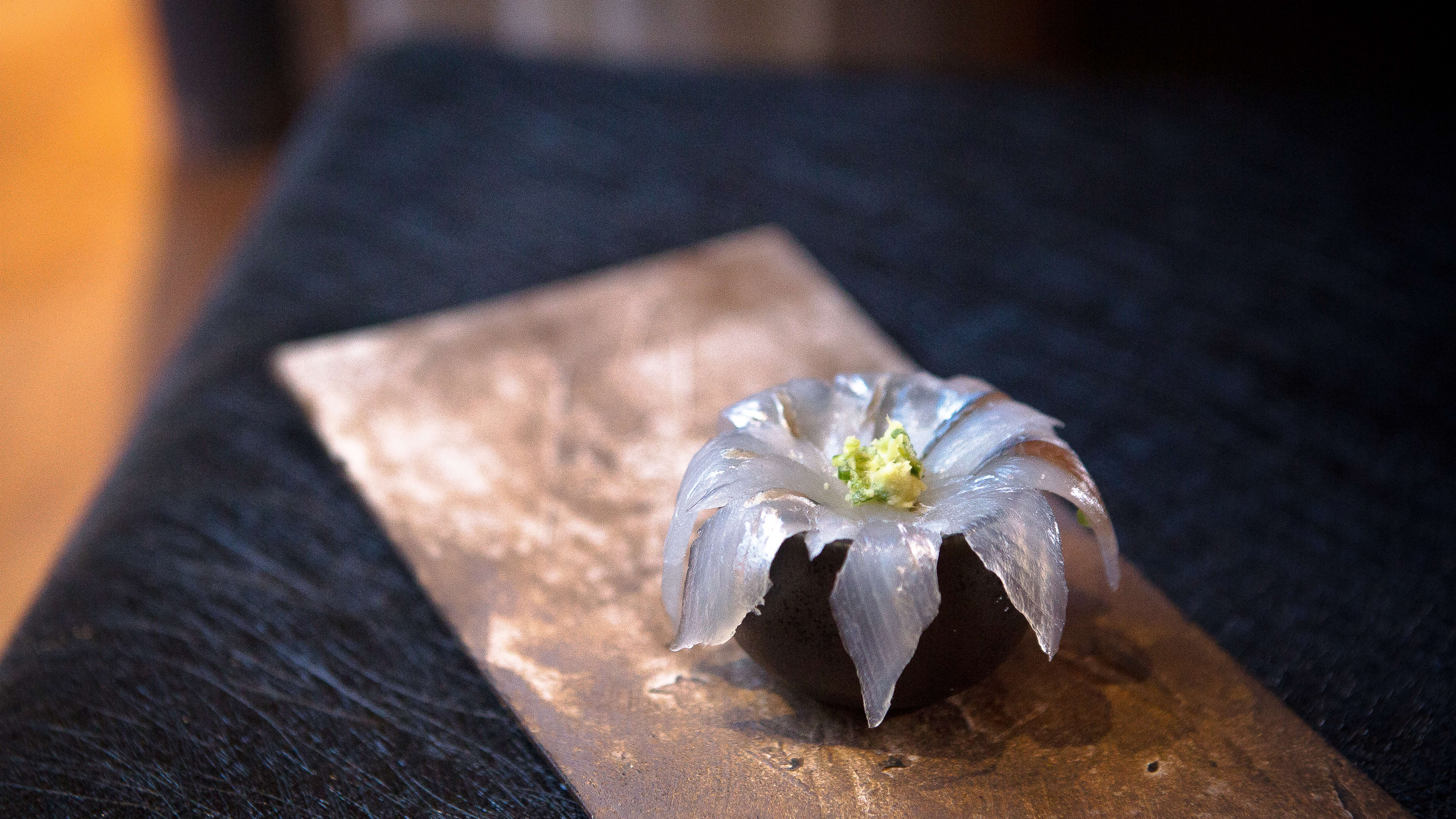 A flower petal shaped nigiri.