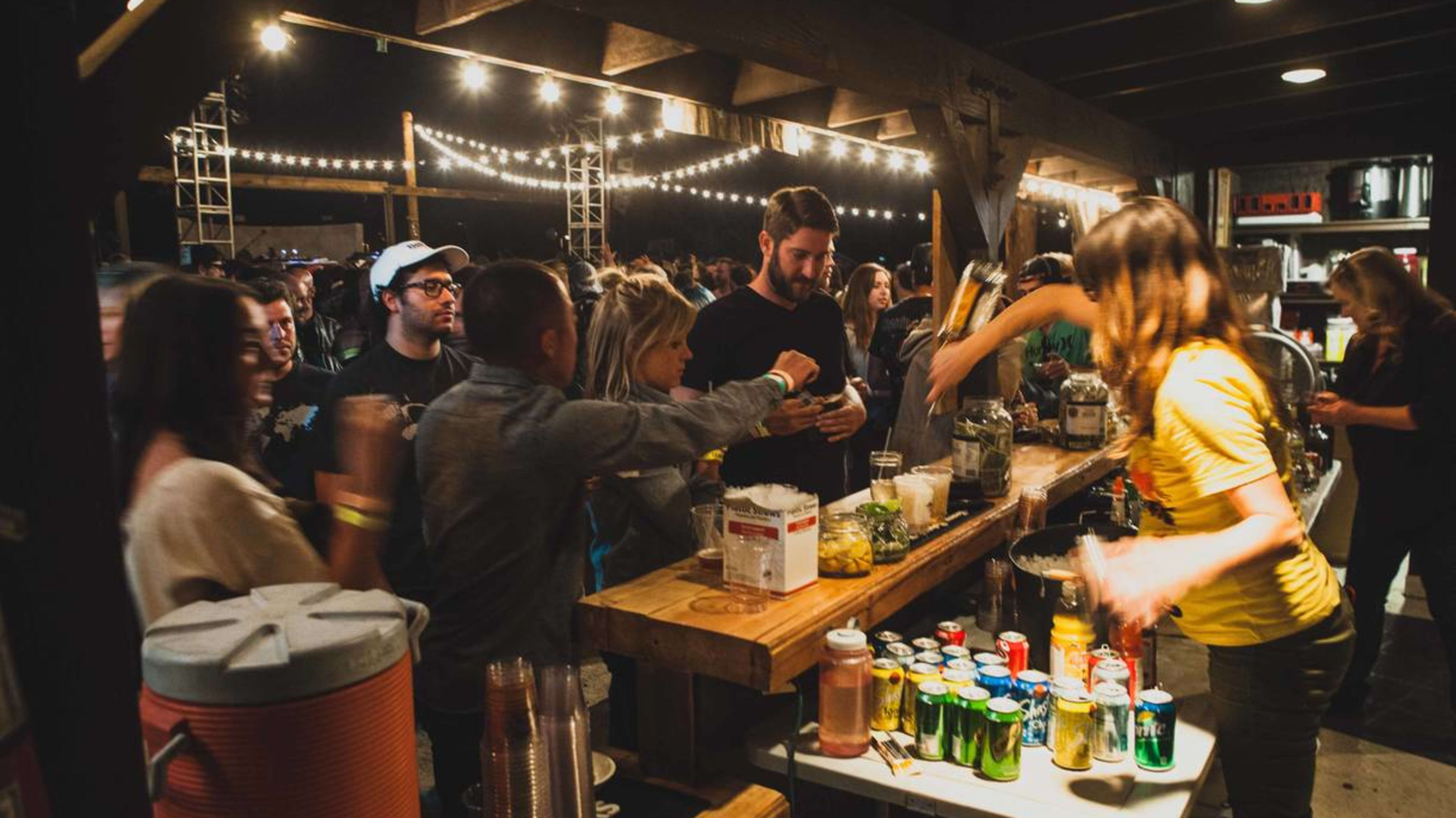 People ordering from the bar at Pappy & Harriet’s.