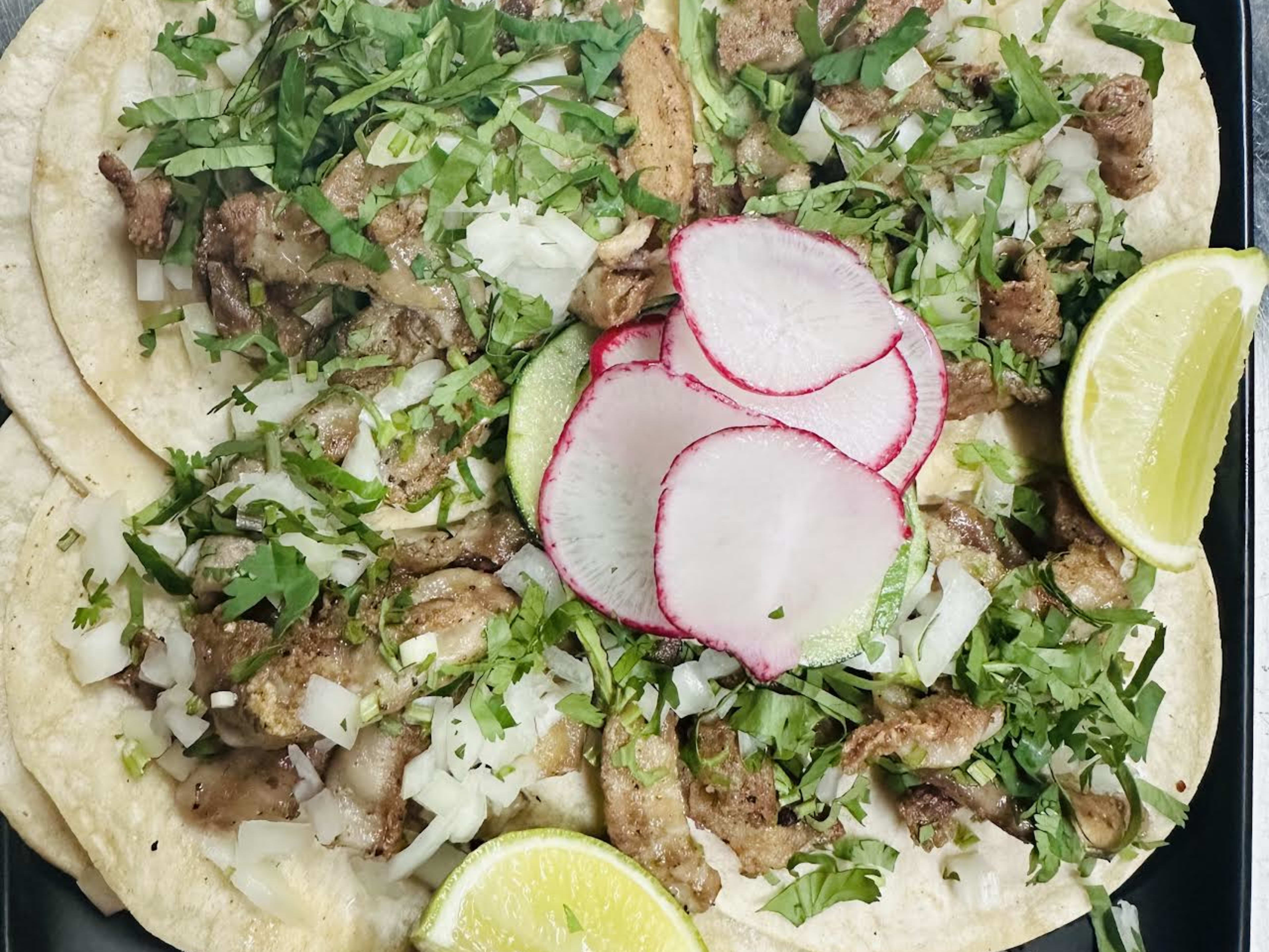 This is a tray of tacos from Taco Man.