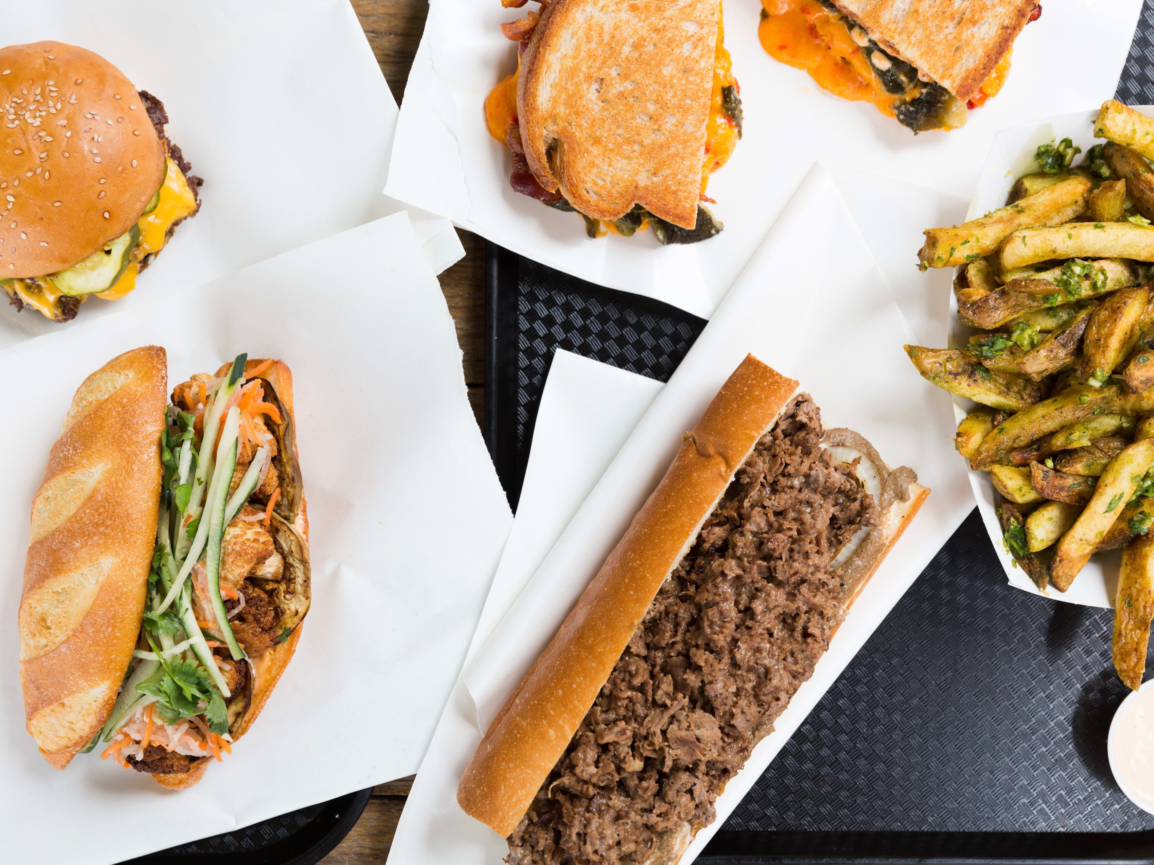 cheesesteak, bahn mi, cheeseburger and fries