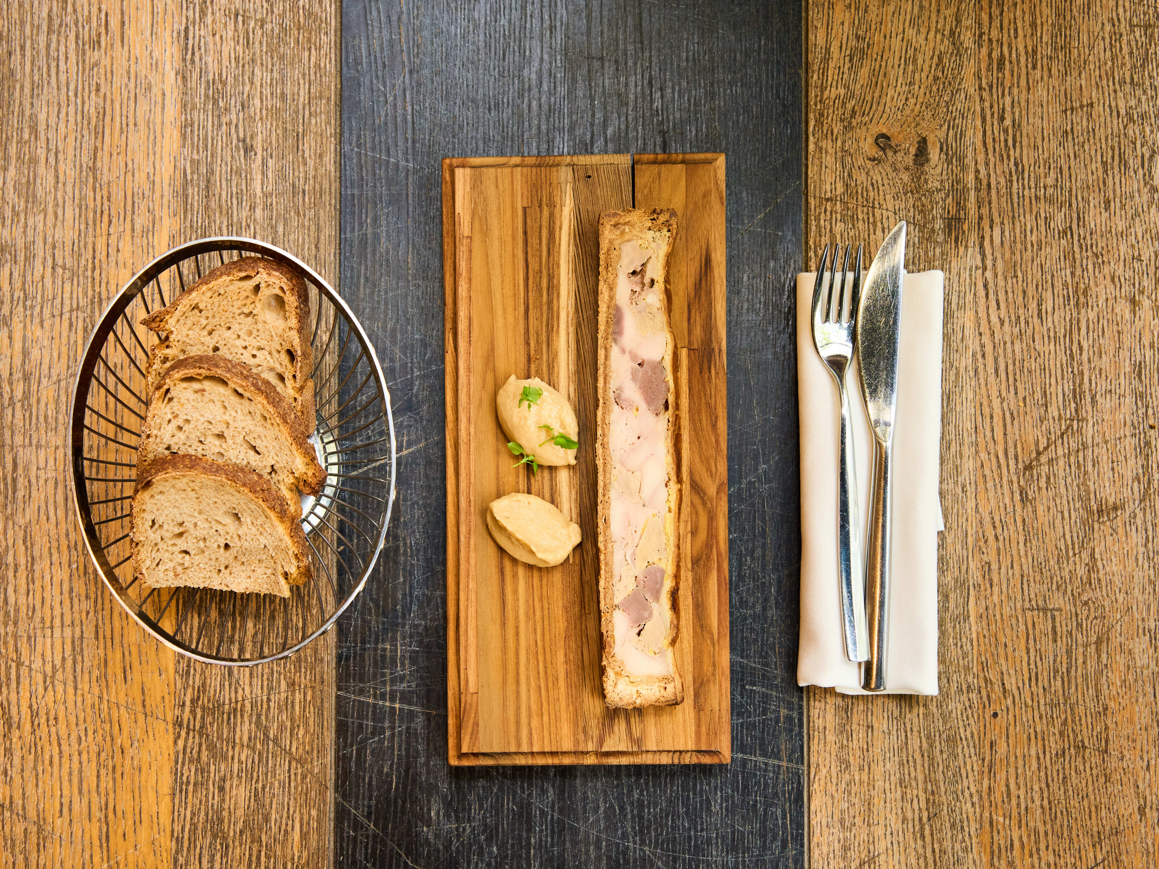 Poultry paté with side of fresh bread at Arnaud Nicolaas