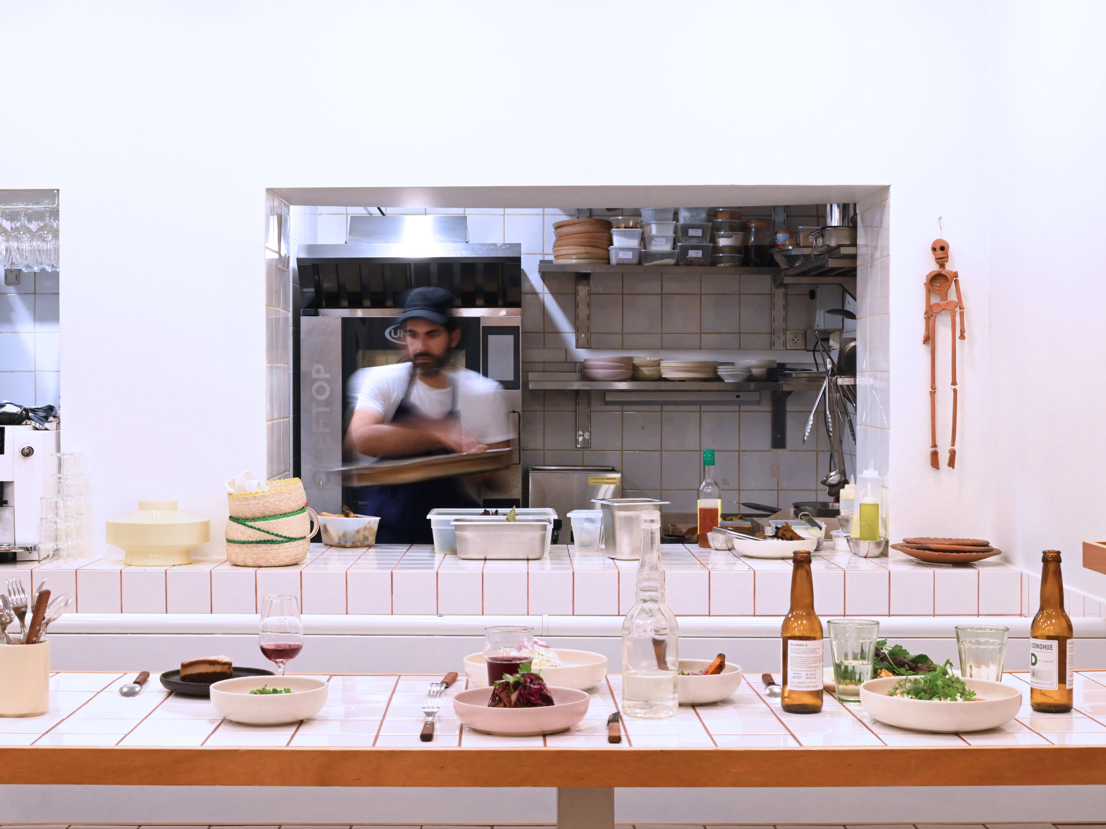 Chef's counter with view of kitchen at Comer in Paris