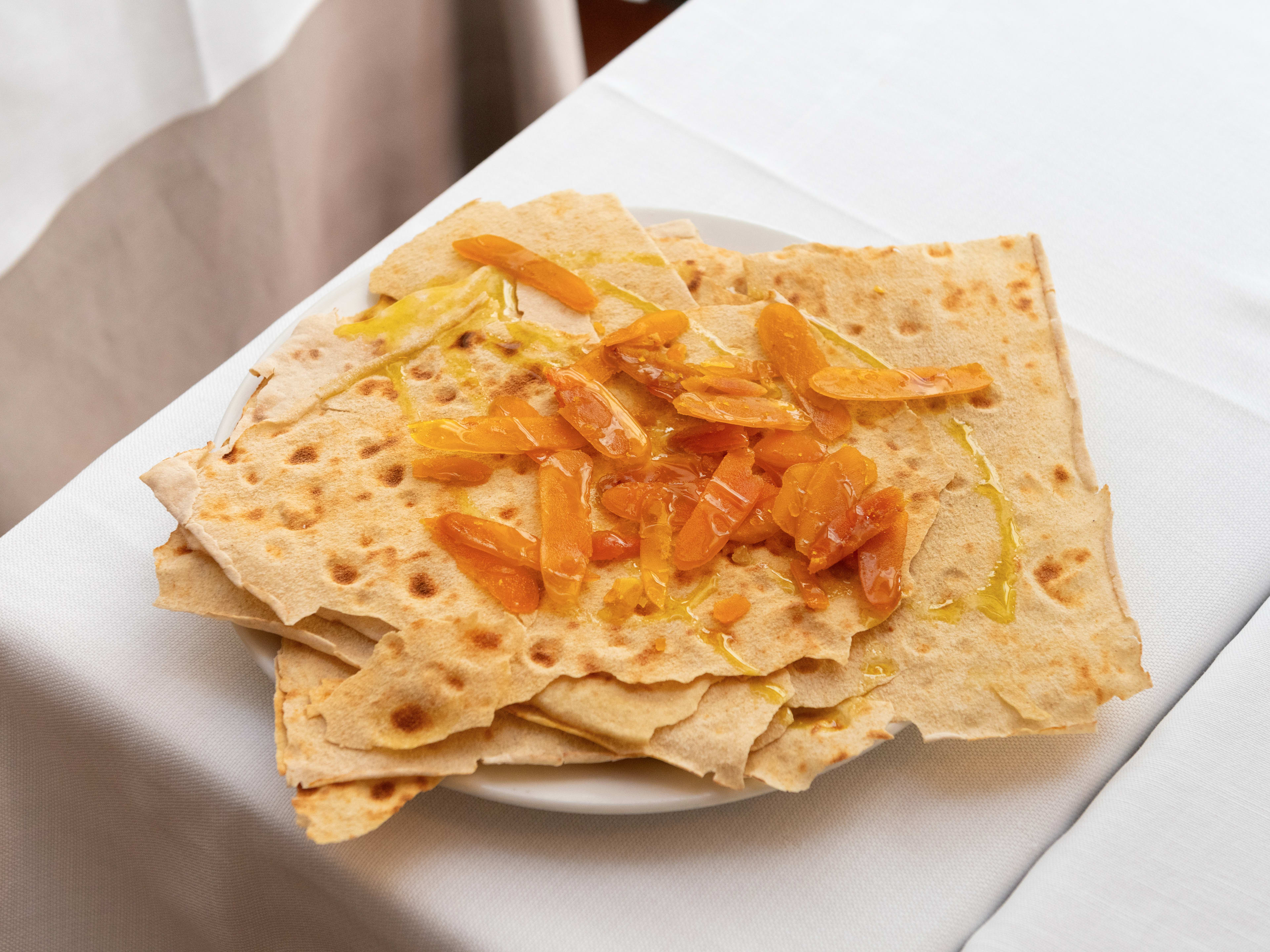 Pane carasau topped with bottarga and olive oil at Capo Boi