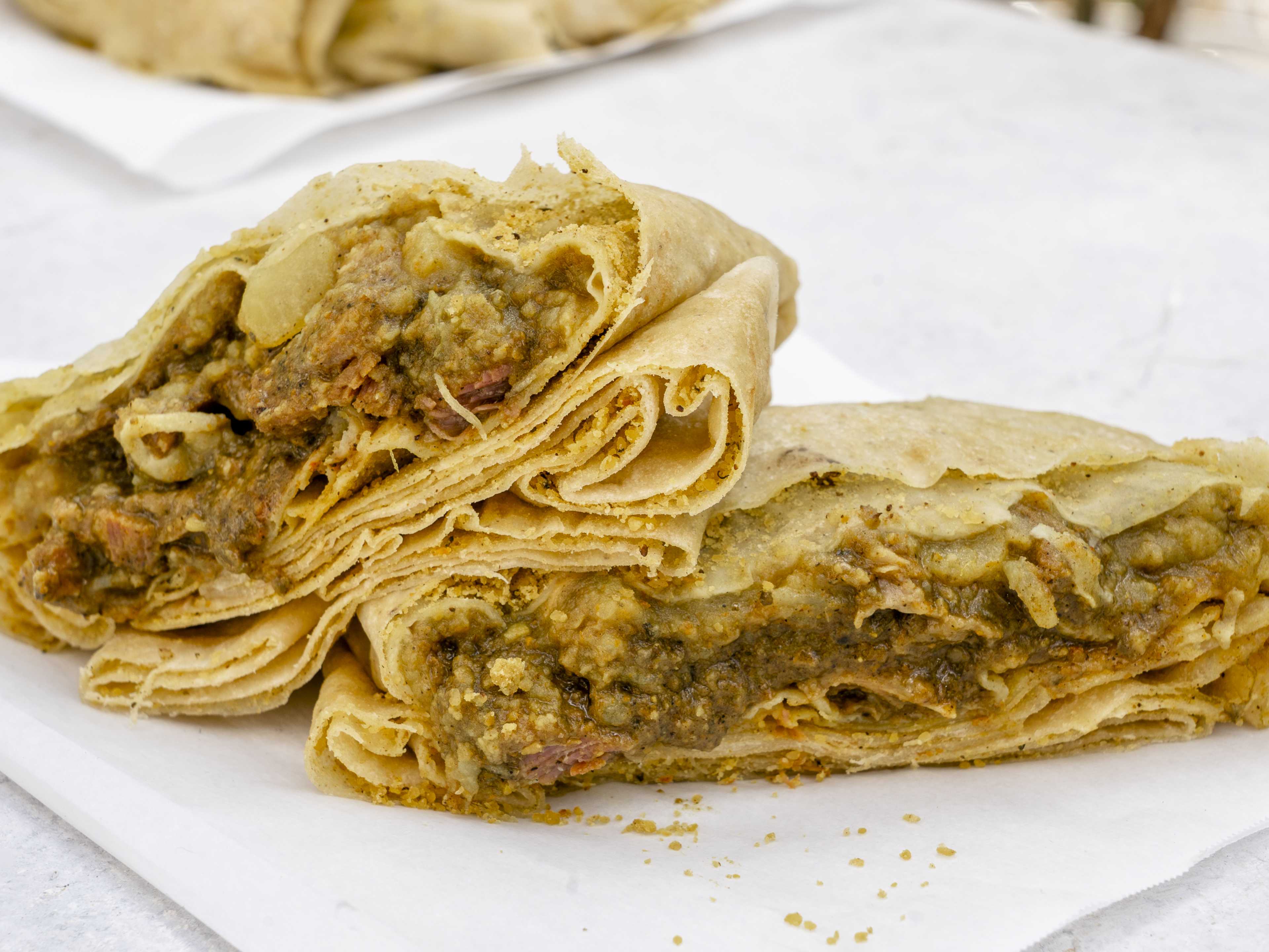 A goat roti cut in half, so you can see the cross-section.