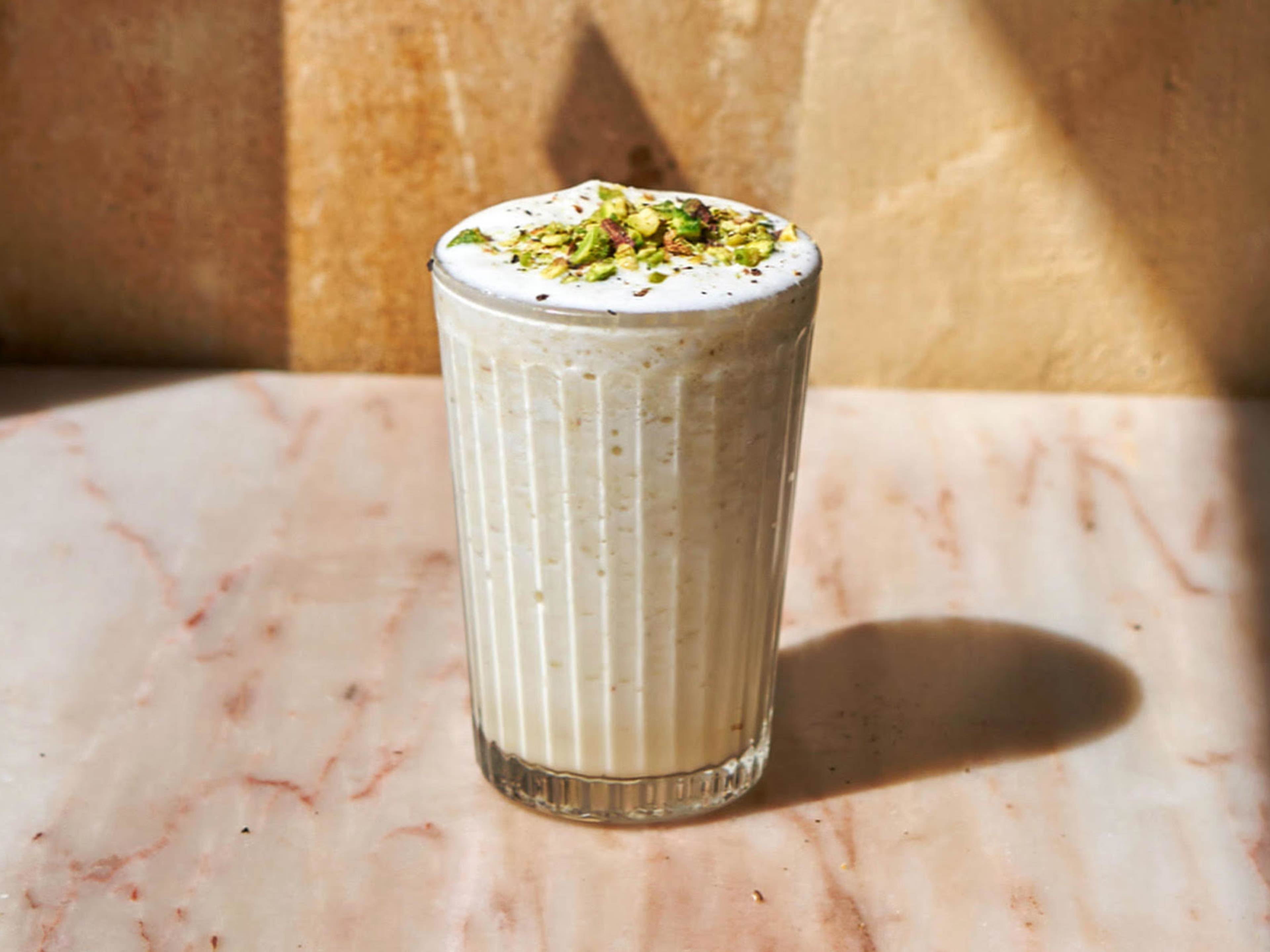 Thick frozen cocktail topped with crushed pistachios at Combat