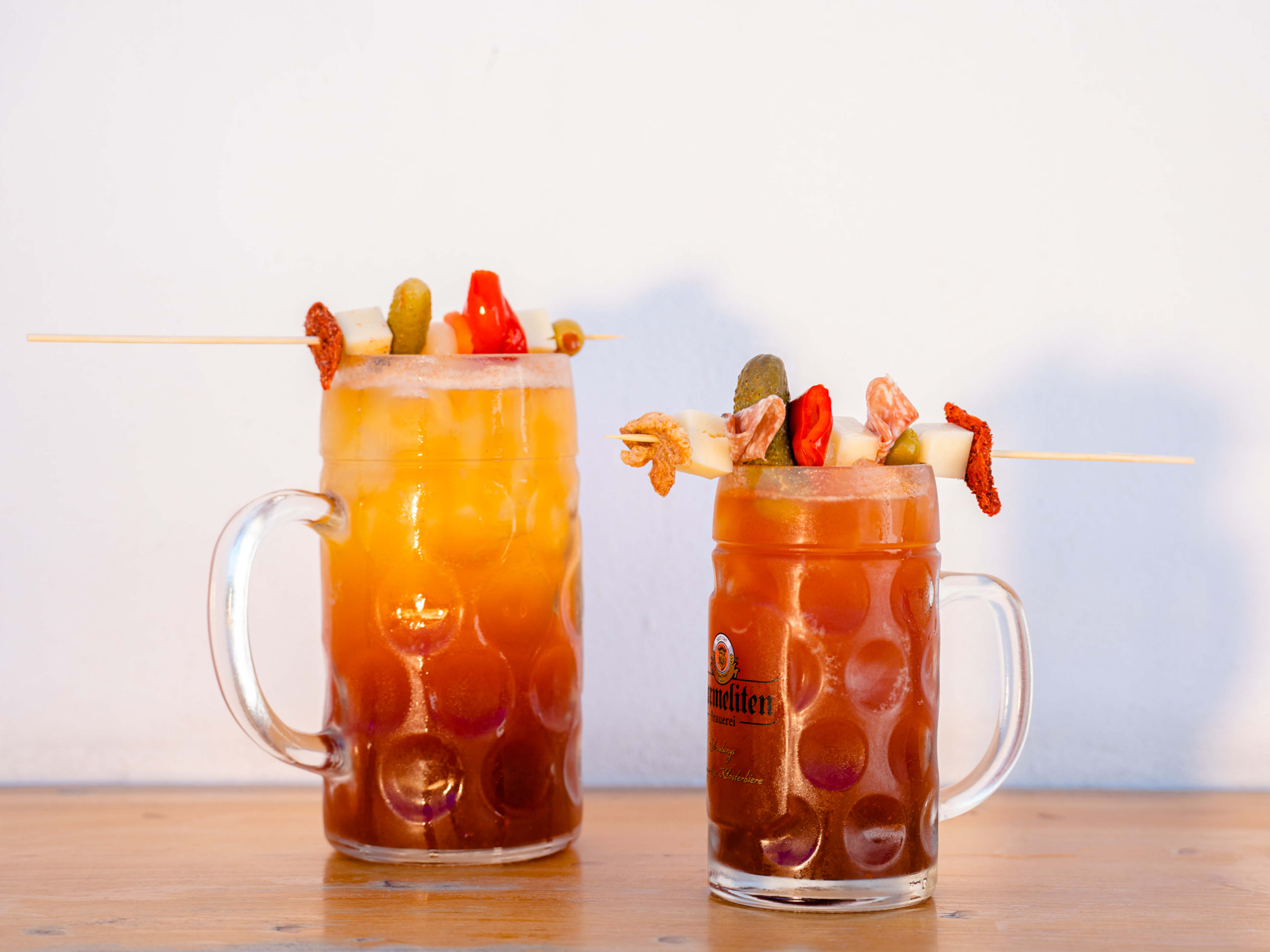 Micheladas topped with pickled garnishes at Bajavaria