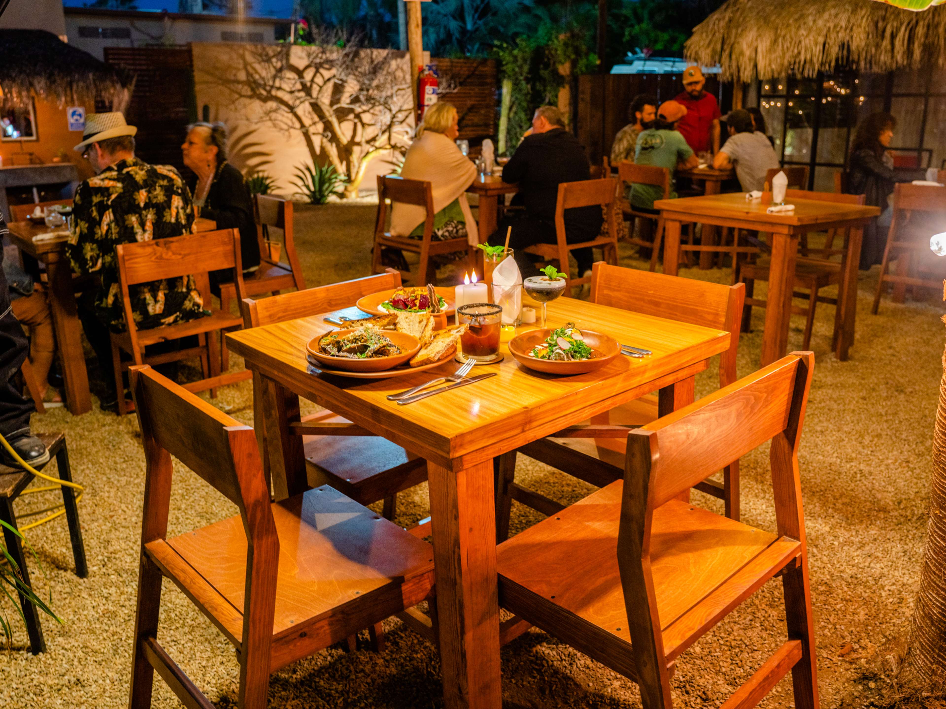 Spread of food on wooden table at Cien Palmas