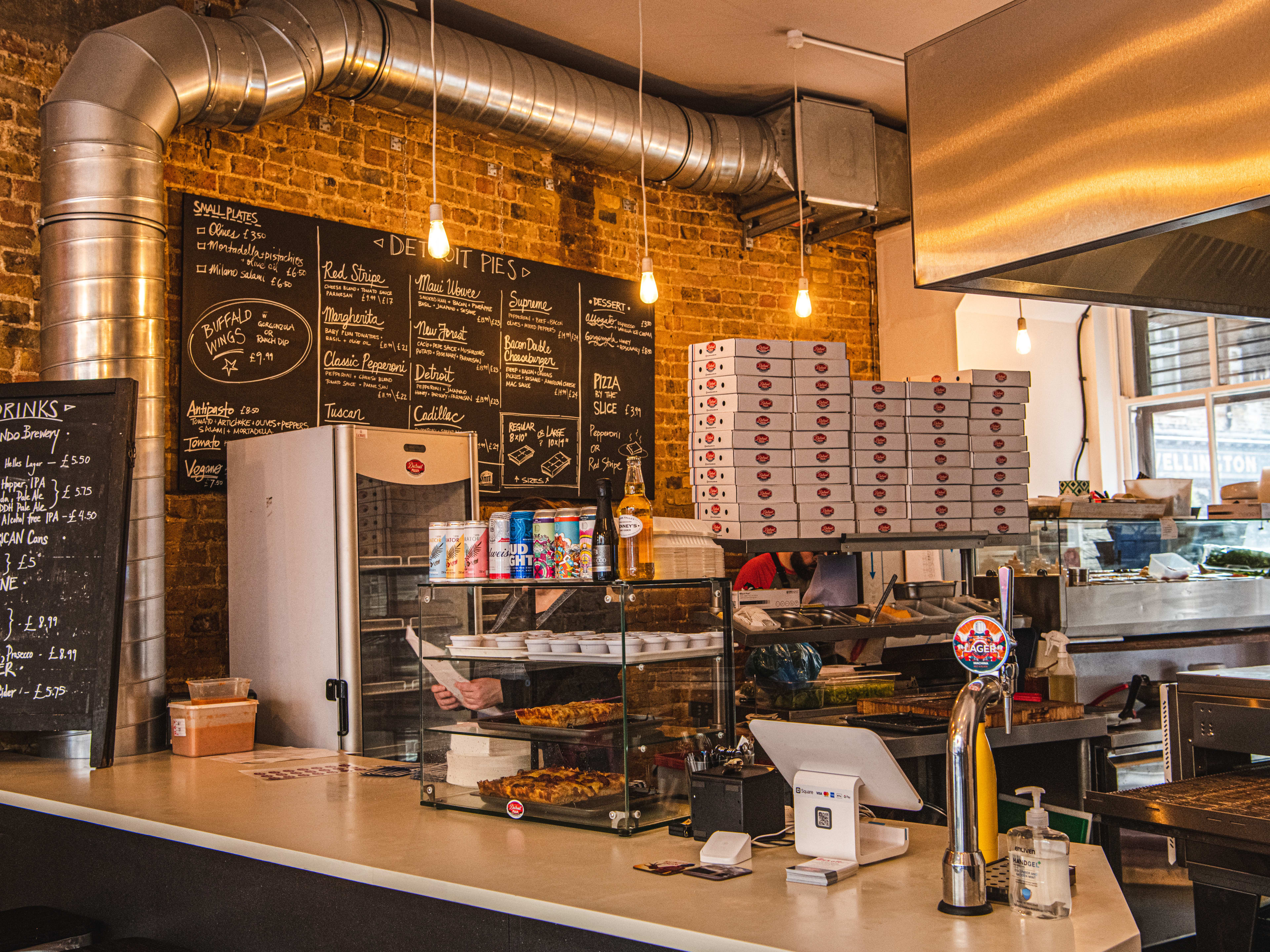 The kitchen and order counter at Detroit Pizza.