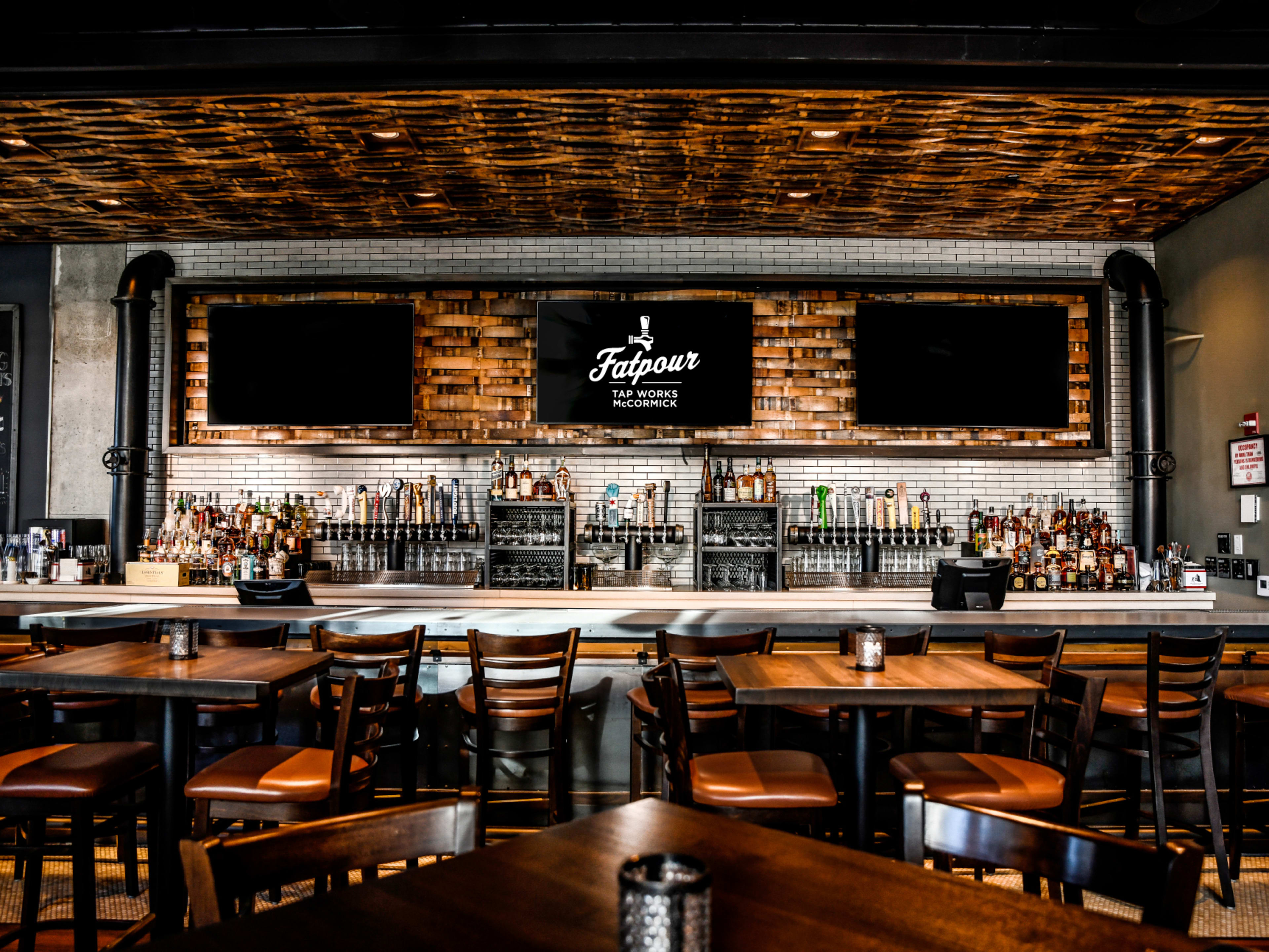 The interior of Fatpour Tap Works with the main bar and tables